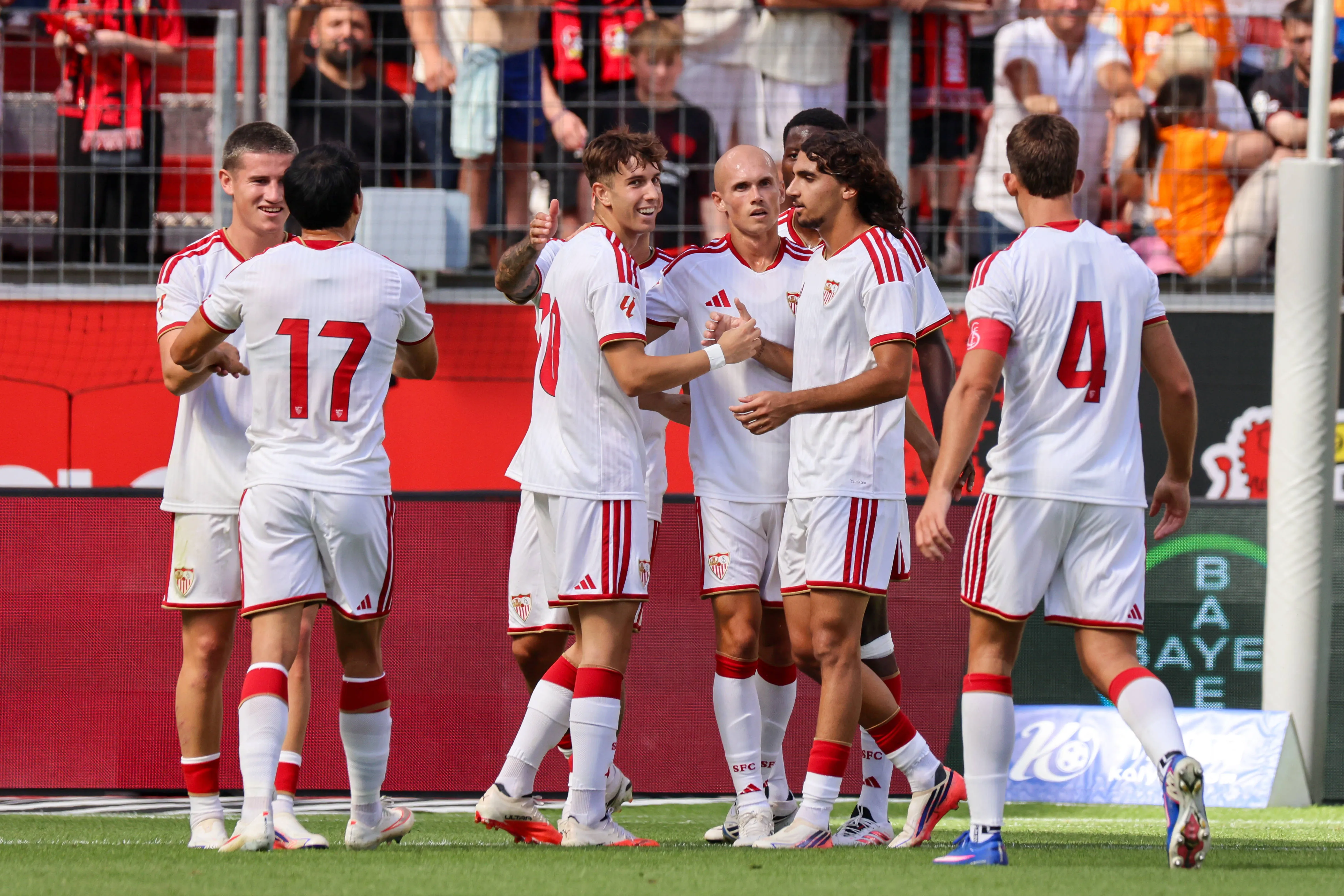 Miguel Sierra, Sevillas third goal scorer, scores the 10 goal for Sevilla and celebrates with his teammates. 