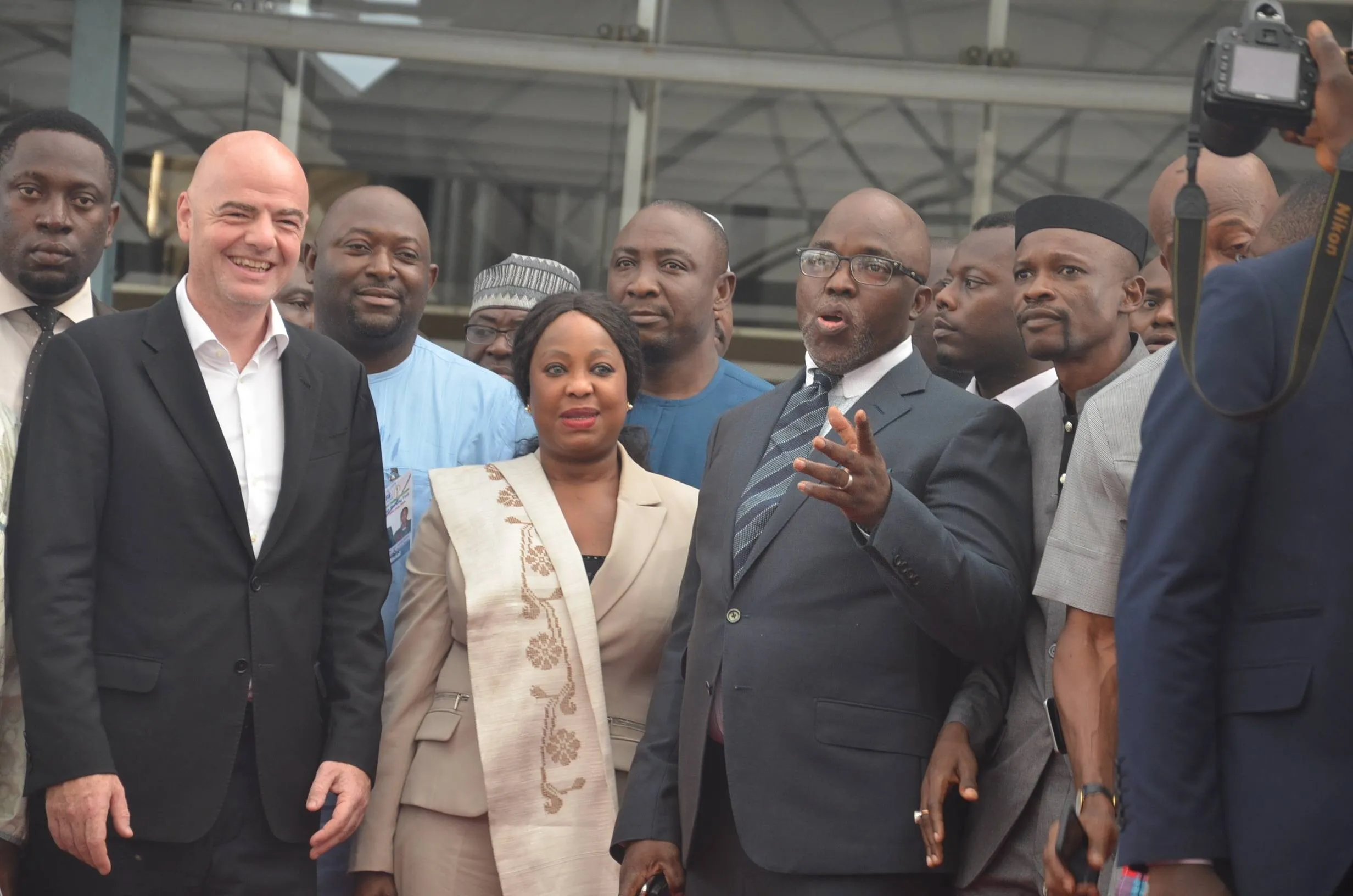 Amaju Pinnick (2nd R, front), former president of Nigeria Football Federation (NFF) (welcomes Gianni Infantino (L front), President of Federation of International Football Associations in Abuja