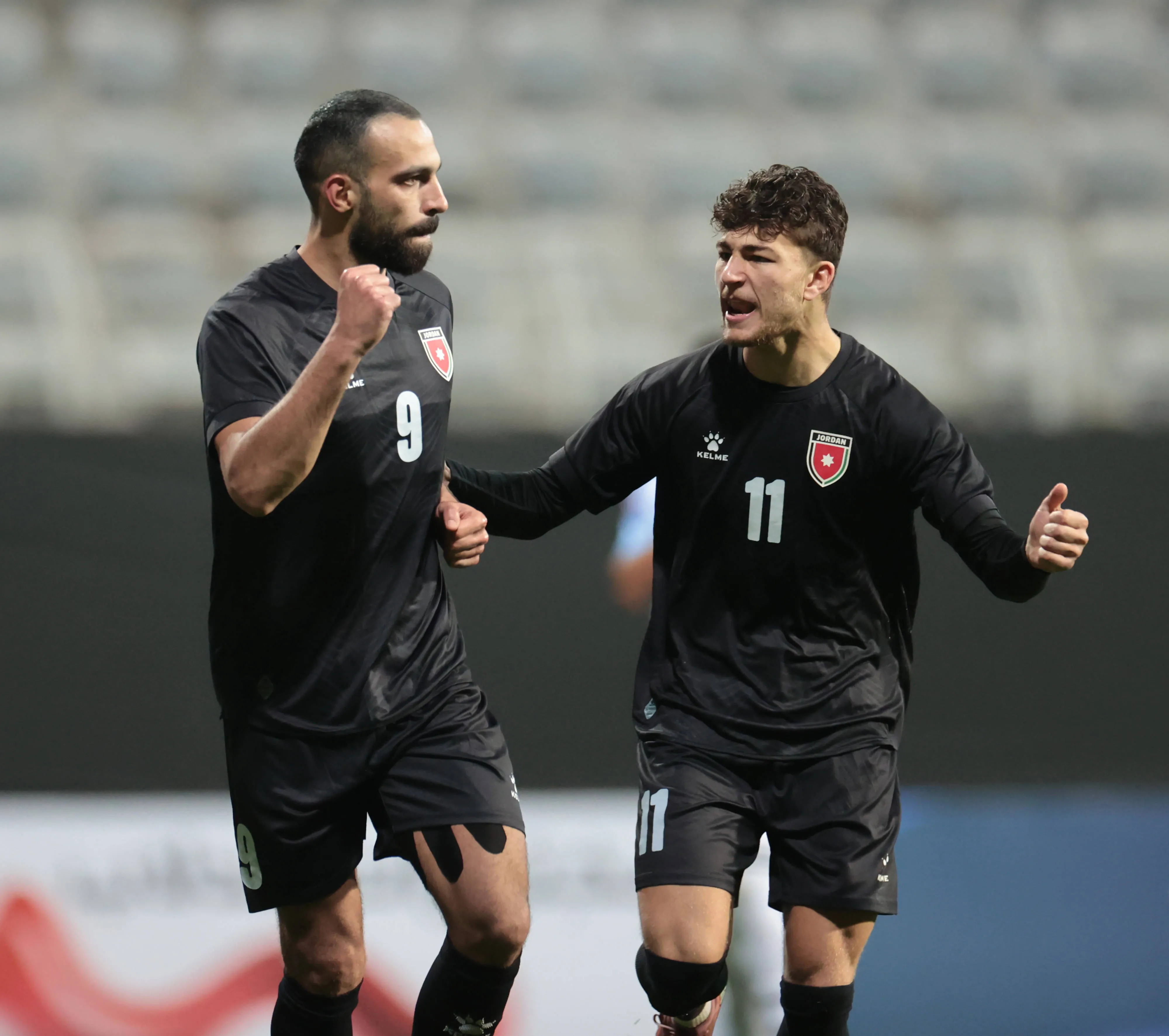 Baha Faisal and Odeh Fakhoury of Jordan celebrate scoring their goal against Costa Rica