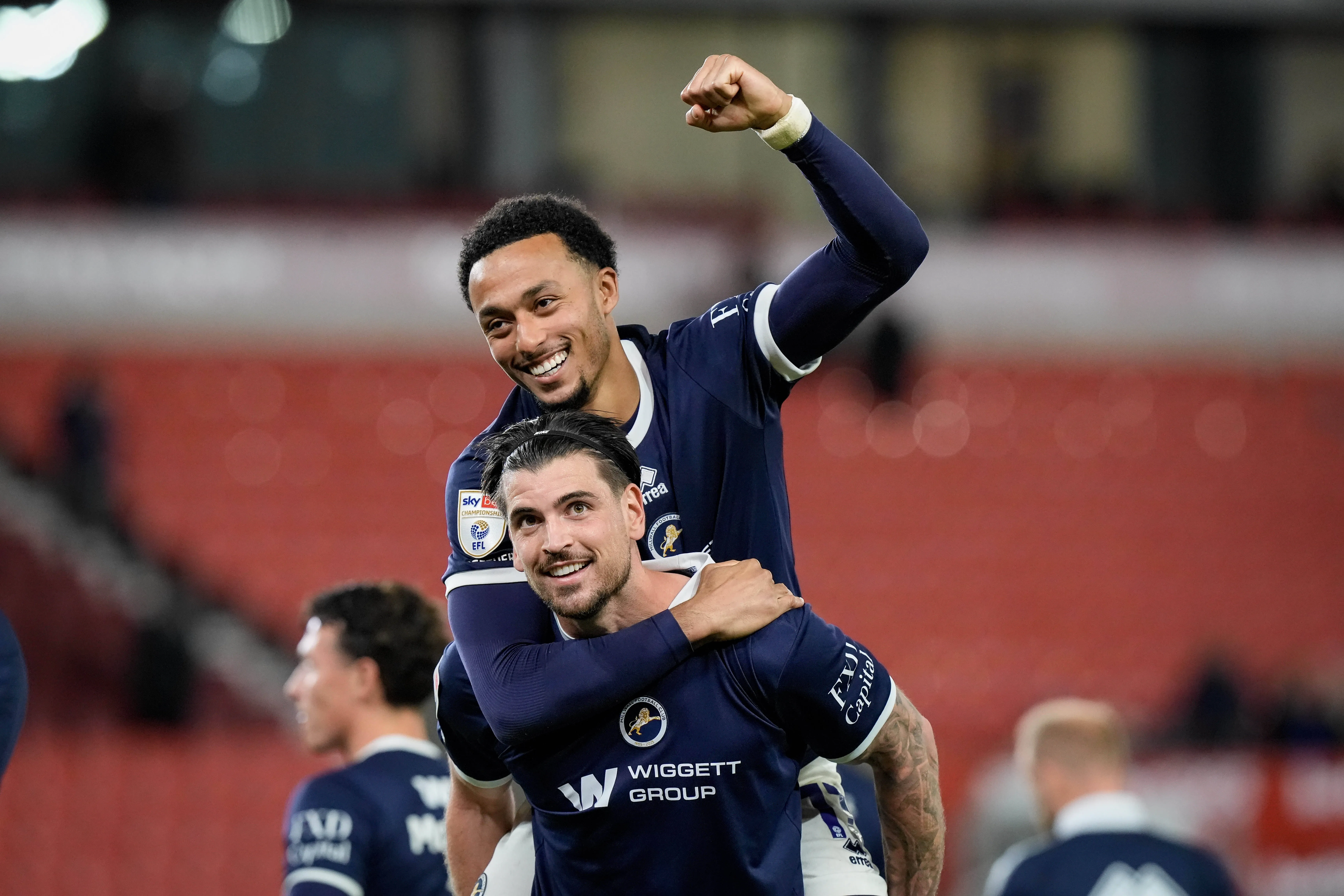 Tristan Crama and Femi Azeez of Millwall celebrate