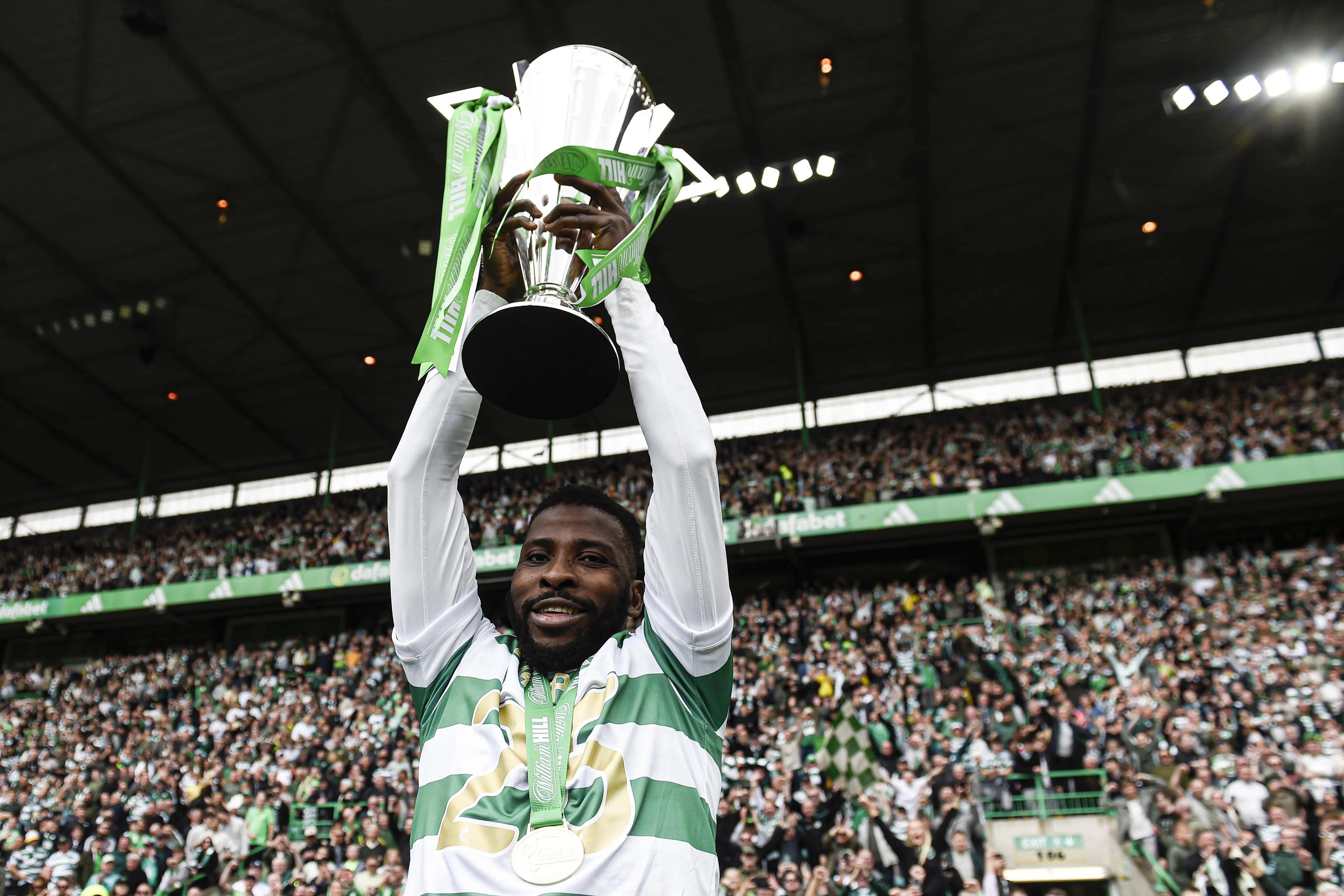 Super Eagles and Celtic star Kelechi Iheanacho poses with the Premiership trophy