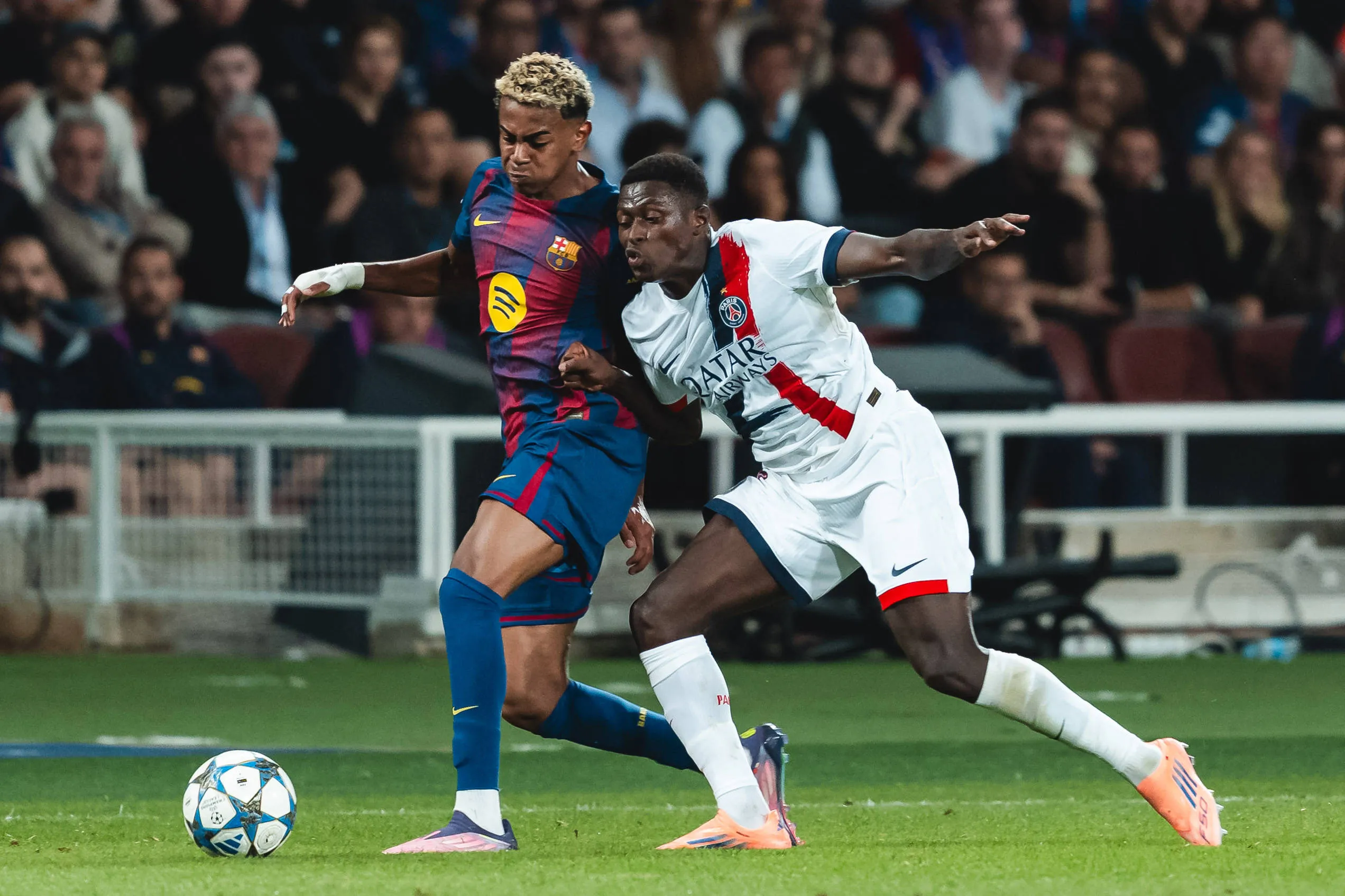 Lamine Yamal battles Nuno Alexandre Tavares Mendes in PSG vs Manchester City