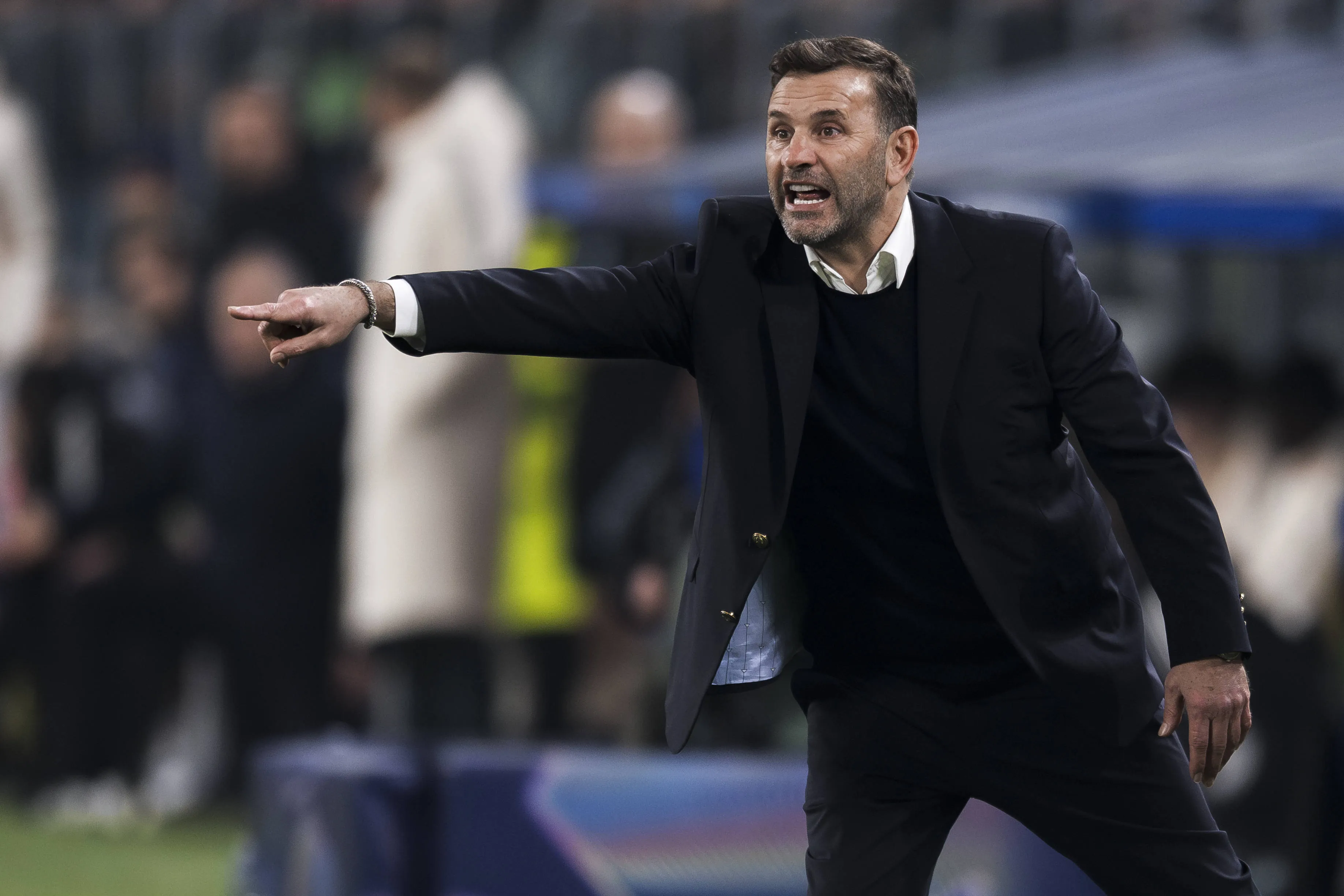 Okan Buruk, head coach of Galatasaray SK, gestures during the UEFA Champions League knockout game between Juventus FC and Galatasaray