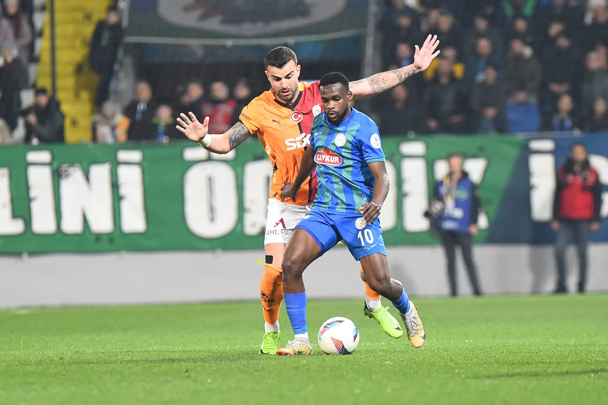 Ibrahim Olawoyin 10 of Caykur Rizespor and Abdulkerim Bardakci of Galatasaray