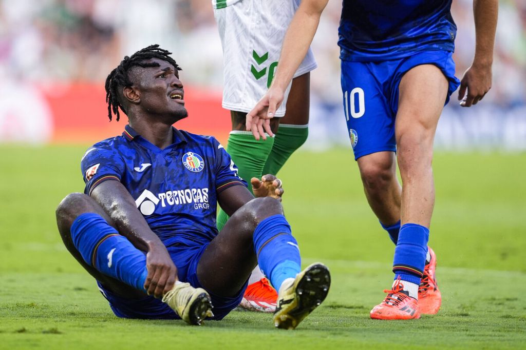 A photo of Super Eagles and Getafe midfielder Christantus Uche sitting on the grass