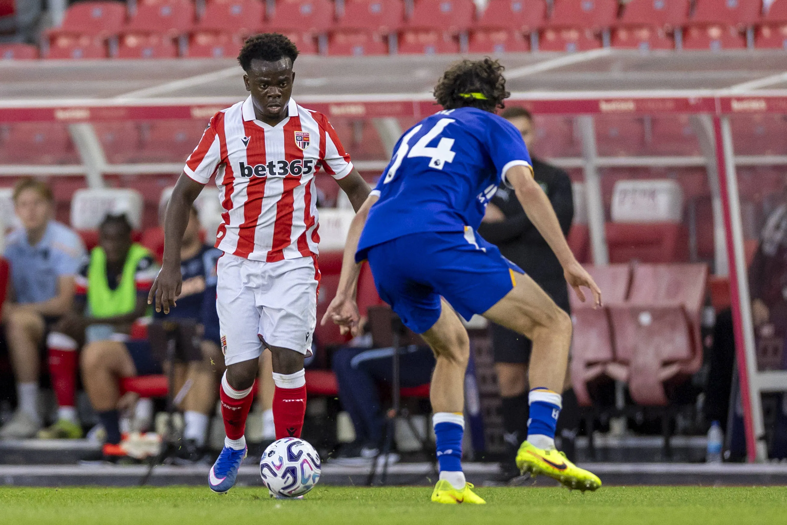Favour Fawunmi of Stoke City under pressure from Merlin Rohl of Everton