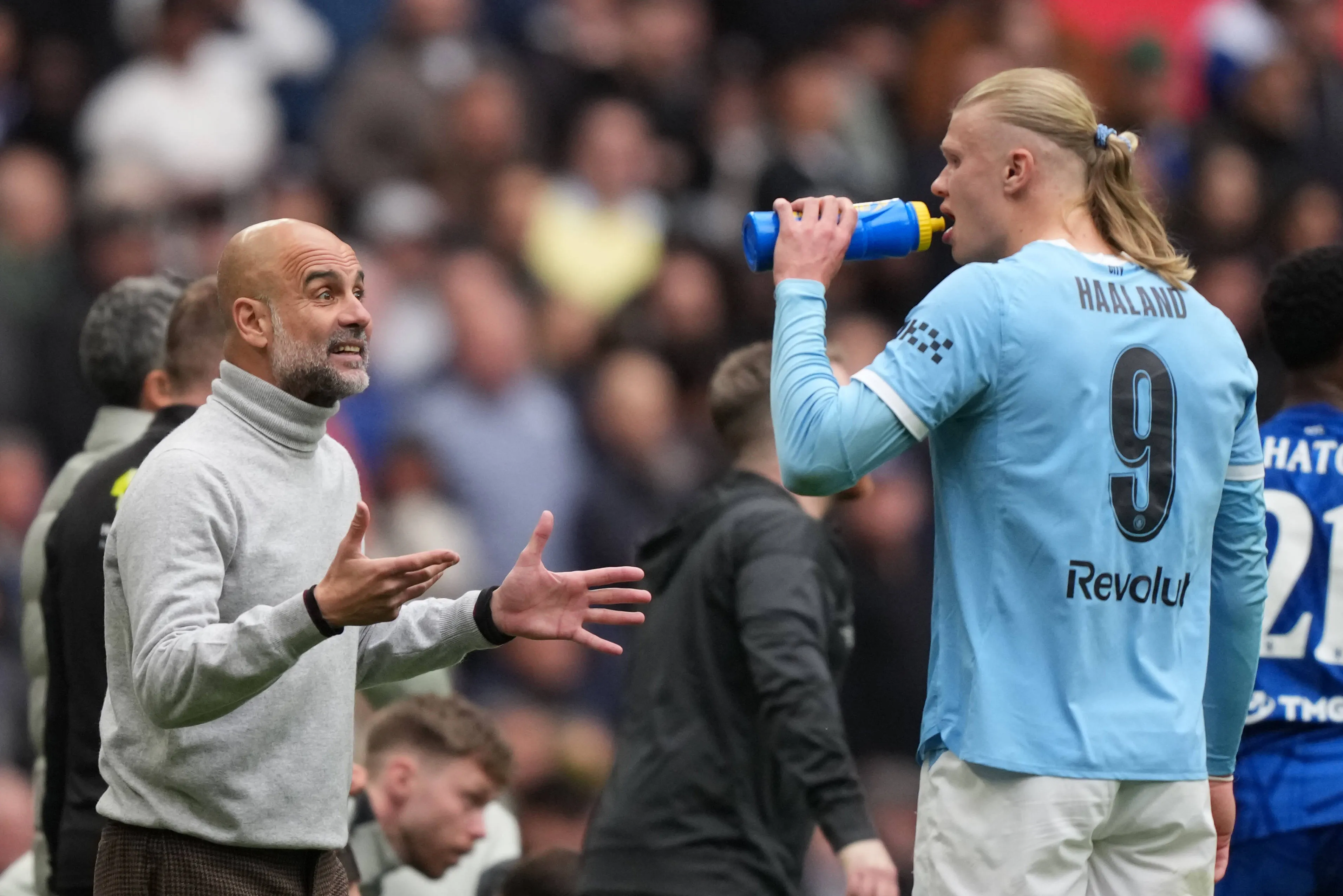 Manchester City boss Pep Guardiola and Erling Haaland