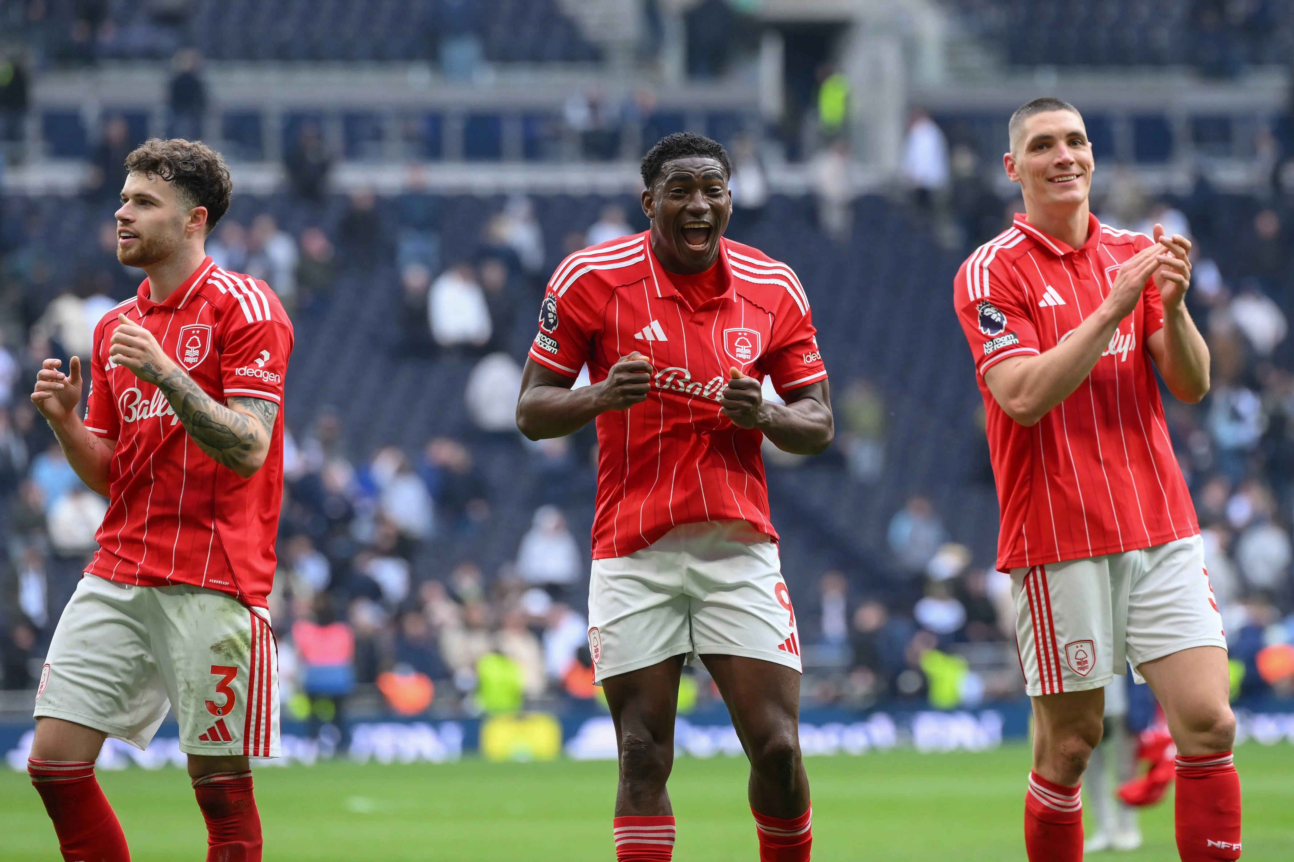 Neco Williams, Taiwo Awoniyi, and Nikola Milenkovic of Nottingham Forest celebrate victory during the Premier League match between Tottenham Hotspur and Nottingham Forest at the Tottenham Hotspur Stadium in London