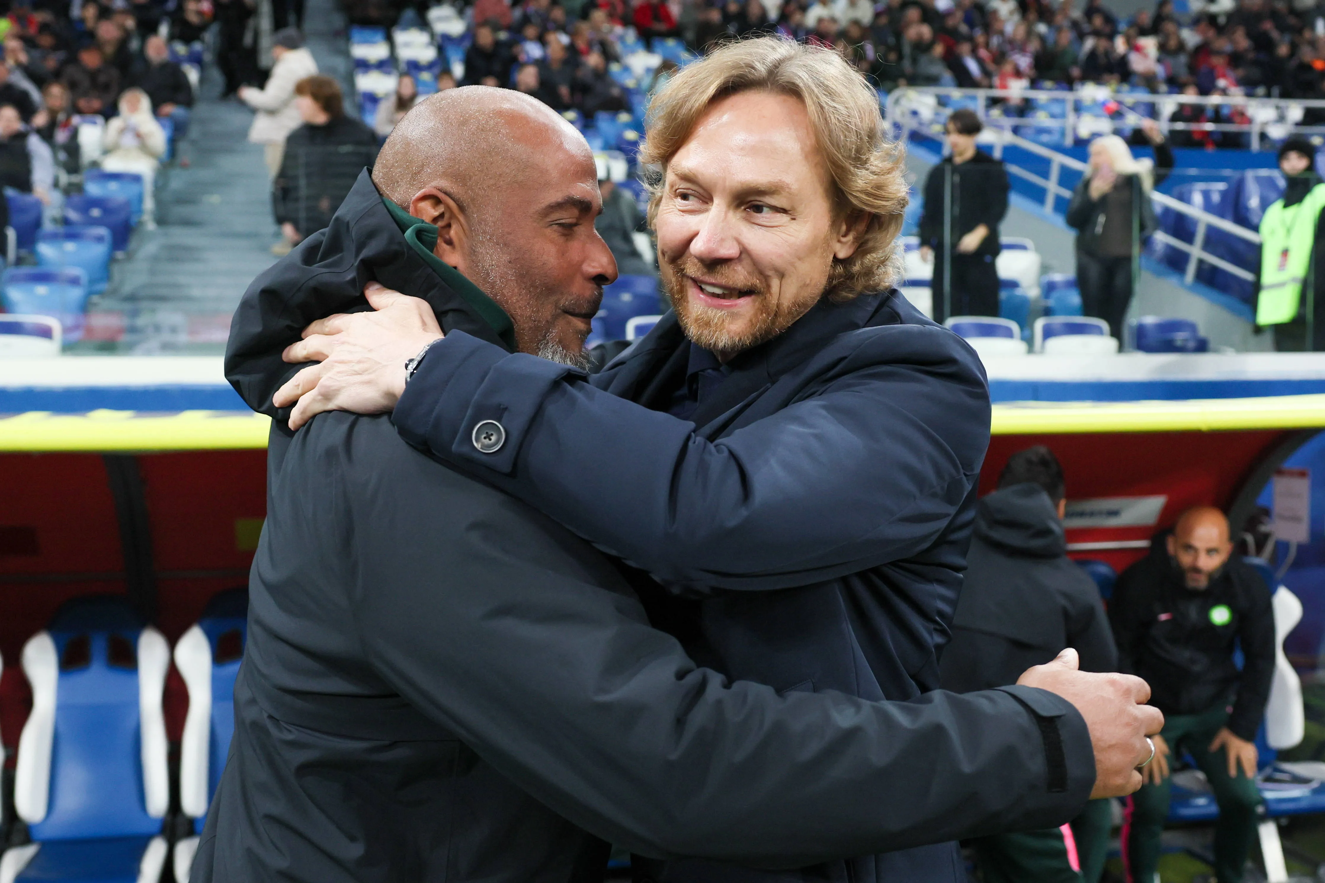 Russia vs Super Eagles, Coaches Eric Chelle and Valery share a hug. 