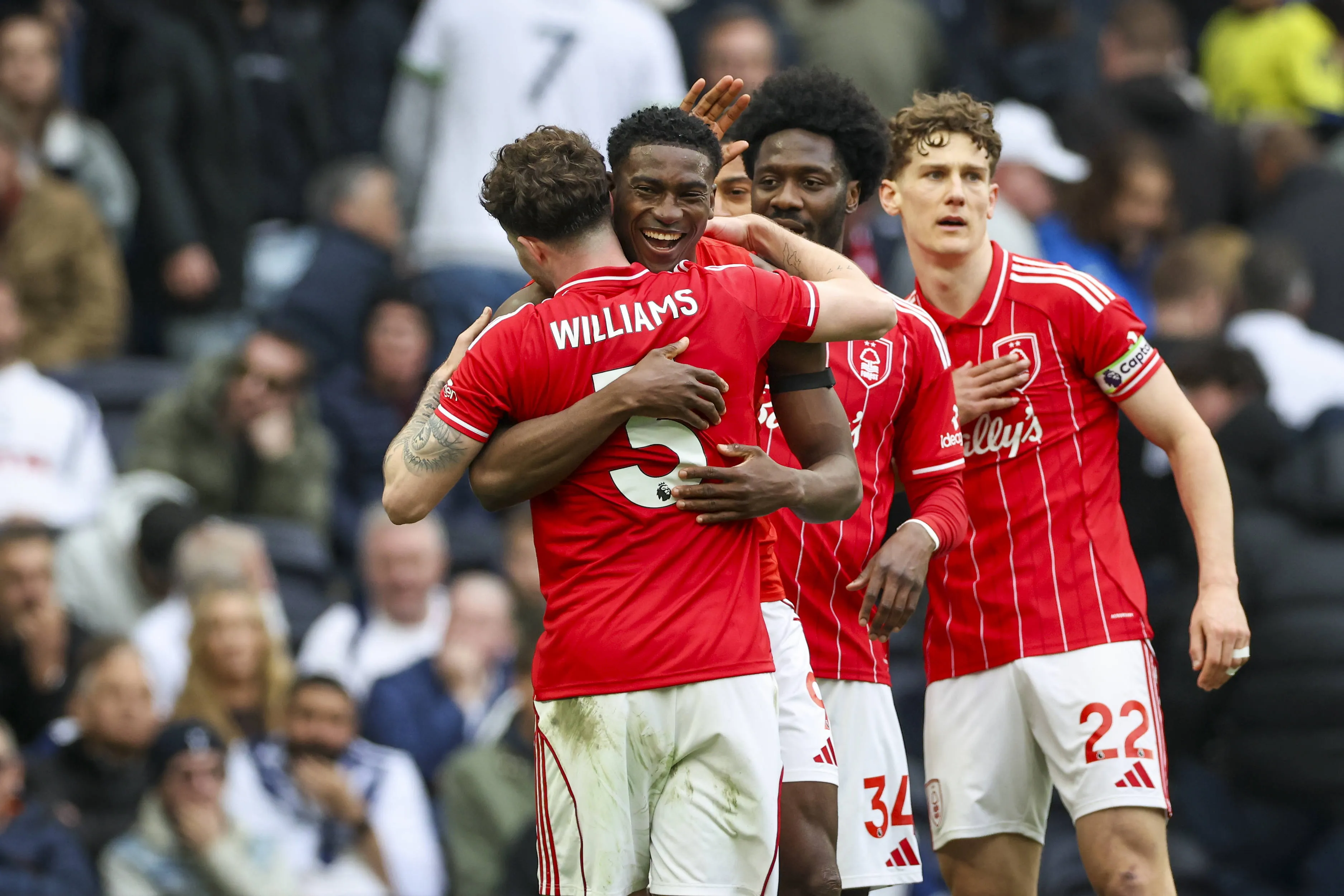 Taiwo Awoniyi 9 scores a GOAL 0-3 and celebrates Nottingham Forest defender Neco Williams 3 Nottingham Forest defender Ola Aina 34 during the Tottenham Hotspur v Nottingham Forest Premier League match.