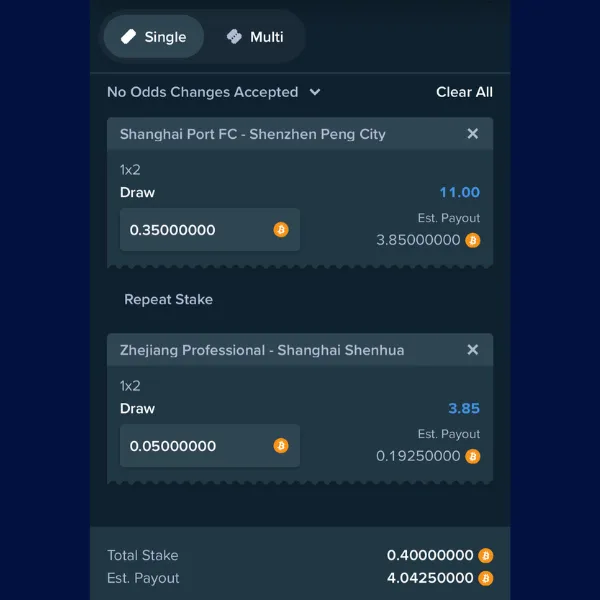Stake.com betting slip showing two bets: one on &ldquo;Shanghai Port FC - Shenzhen Peng City&rdquo; with a stake of 0.35 BTC and an estimated payout of 3.85 BTC, and another on &ldquo;Zhejiang Professional - Shanghai Shenhua&rdquo; with a stake of 0.05 BTC and an estimated payout of 0.19 BTC. Total stake and estimated payout are displayed at the bottom.