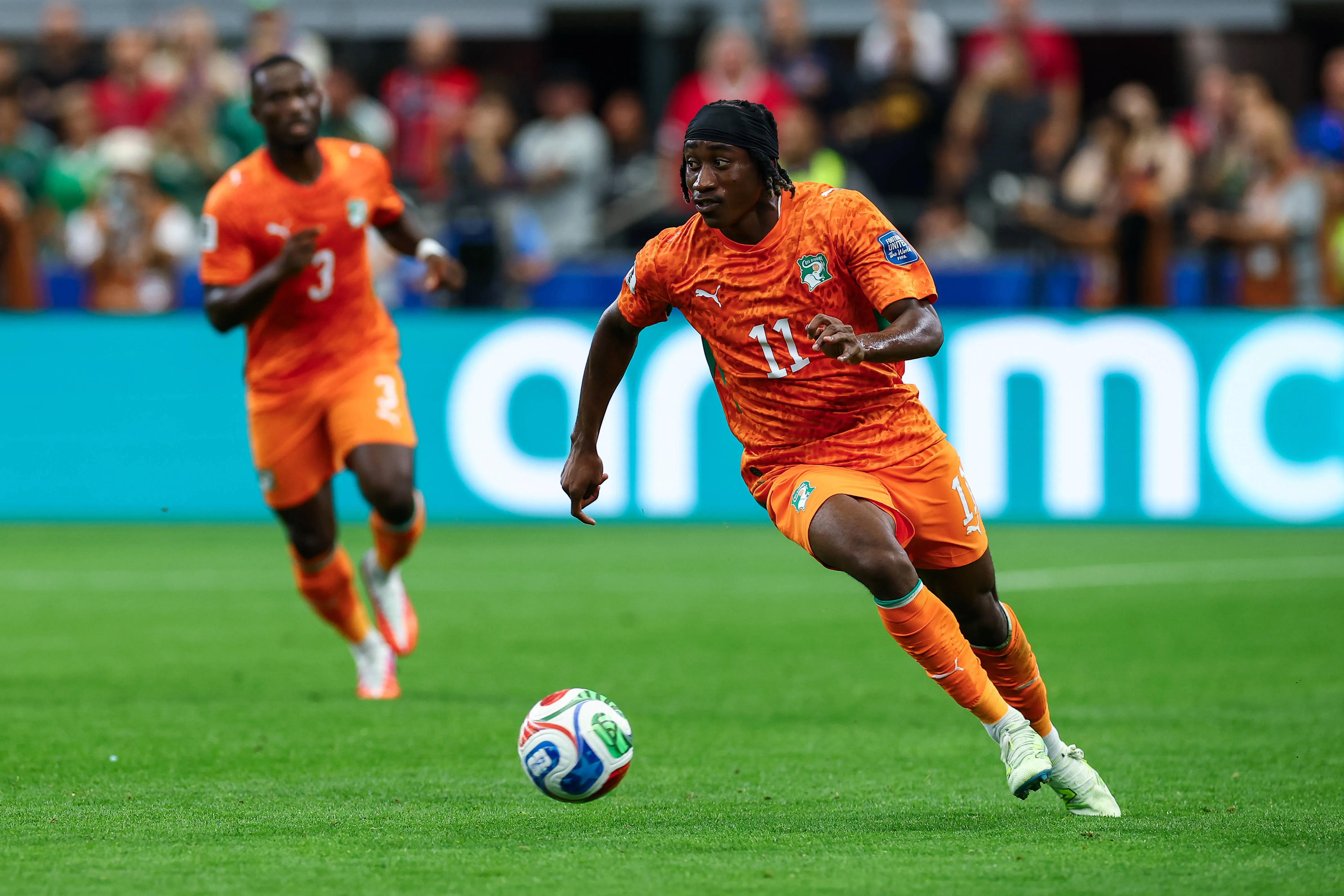 Cote d' Ivoire winger Yan Diomande dribbles up field