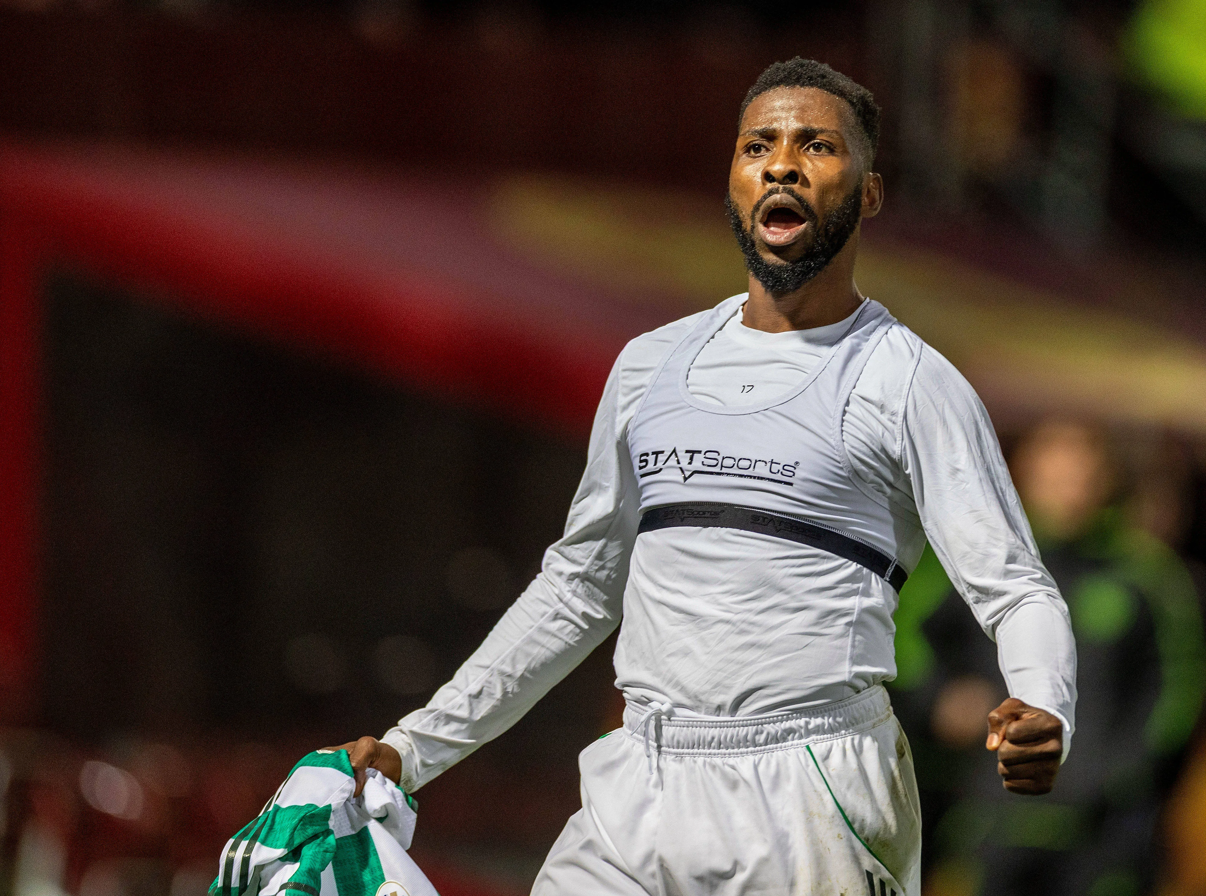 Kelechi Iheanacho of Celtic celebrates after his penalty wins the match against Motherwell