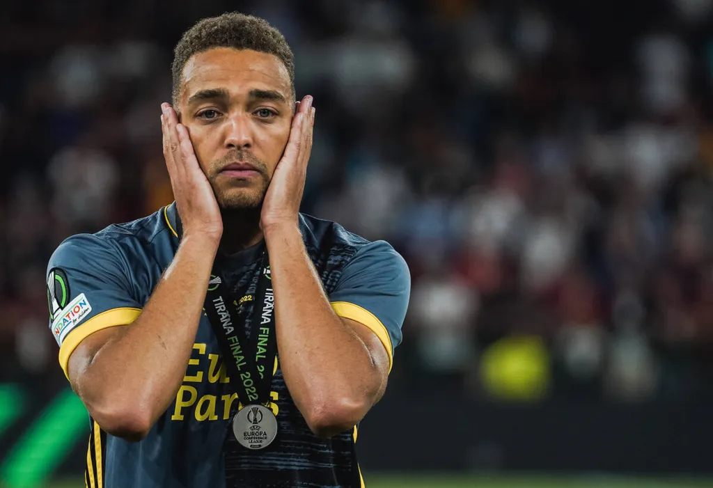 Cyriel Dessers looks dejected, as he receives the runner-up medal after the UEFA Europa Conference League final match be