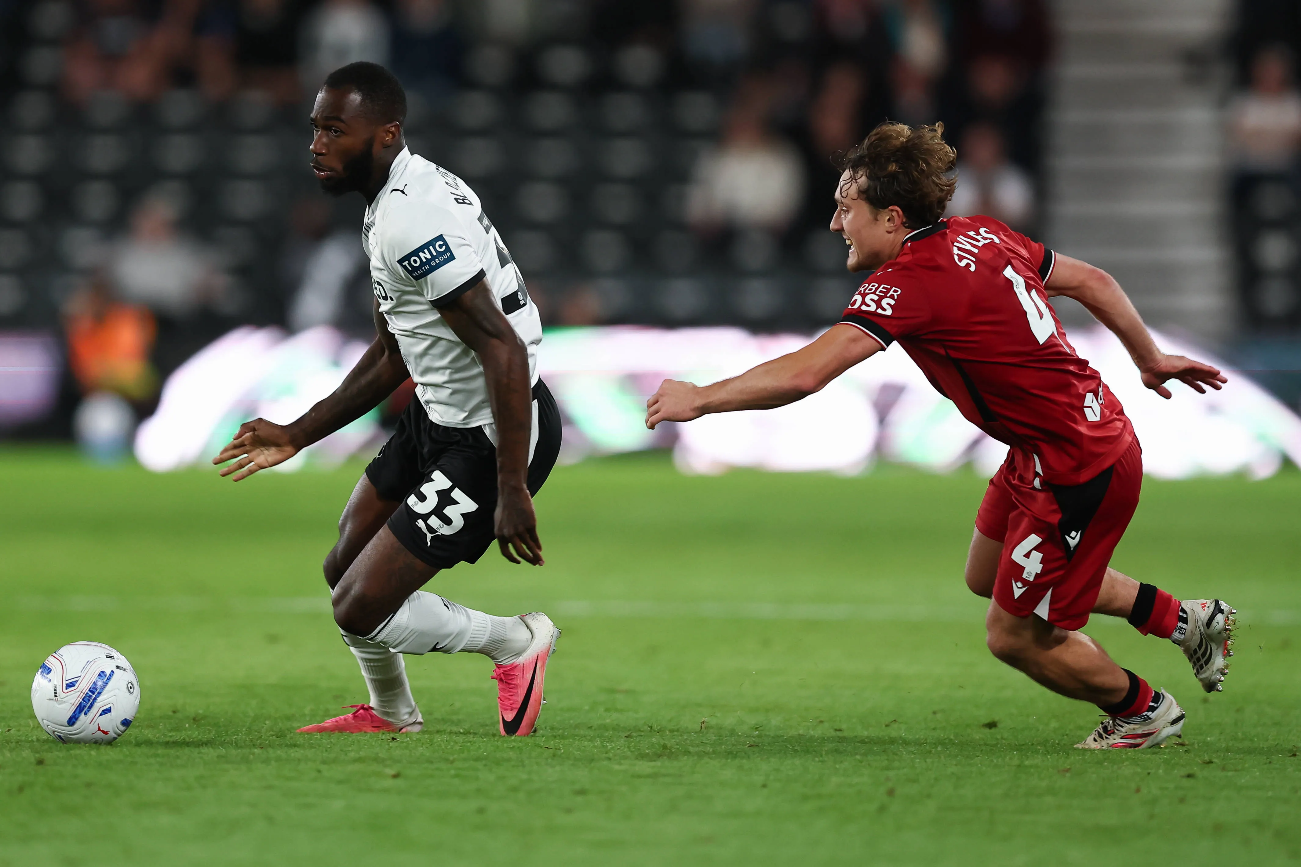Corey Blackett-Taylor of Derby County drives past Callum Styles of West Bromwich Albion