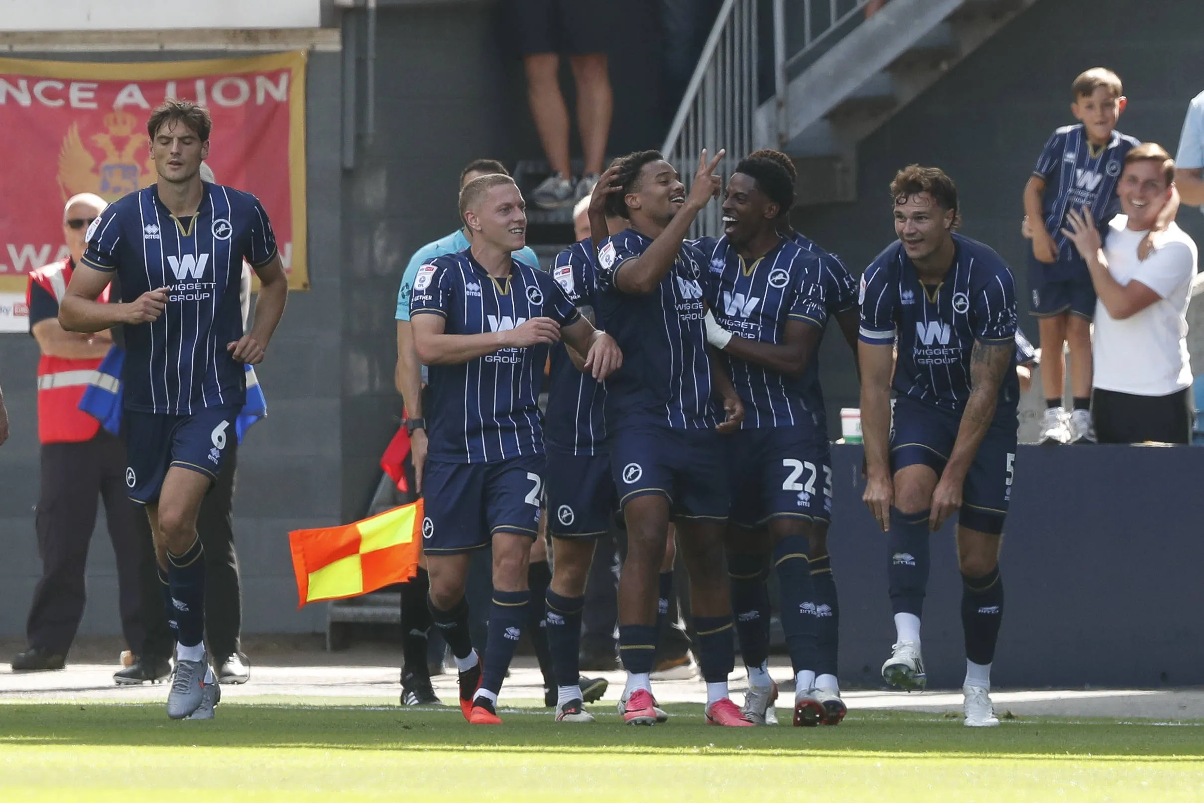Tairyk Arconte of Millwall celebrates with teammates 