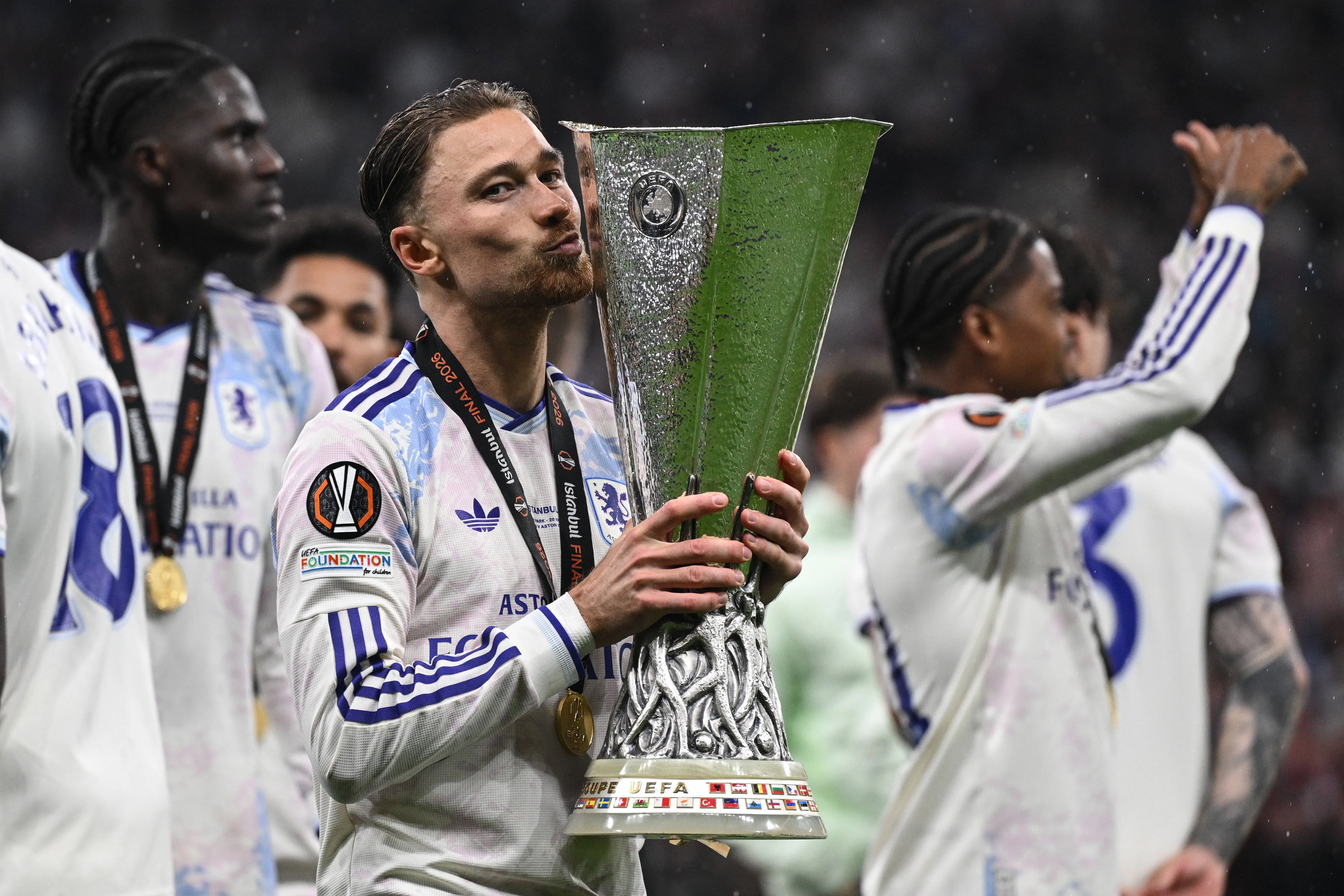 Aston Villa's Matty Cash lifts the Europa League trophy