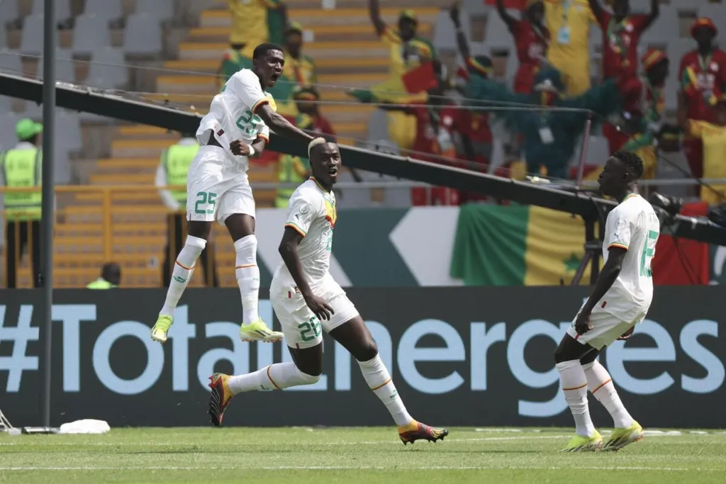 Pape Alassane Gueye of Senegal celebrates his AFCON 2023 goal with teammates