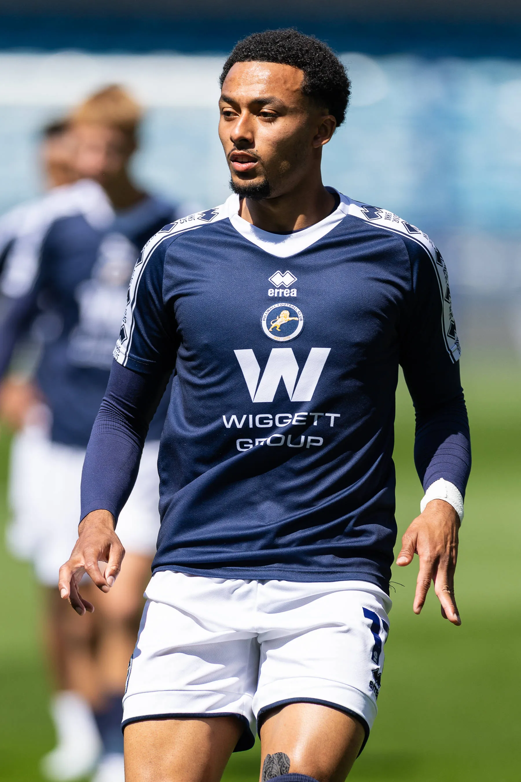 Millwall forward Femi Azeez warms up