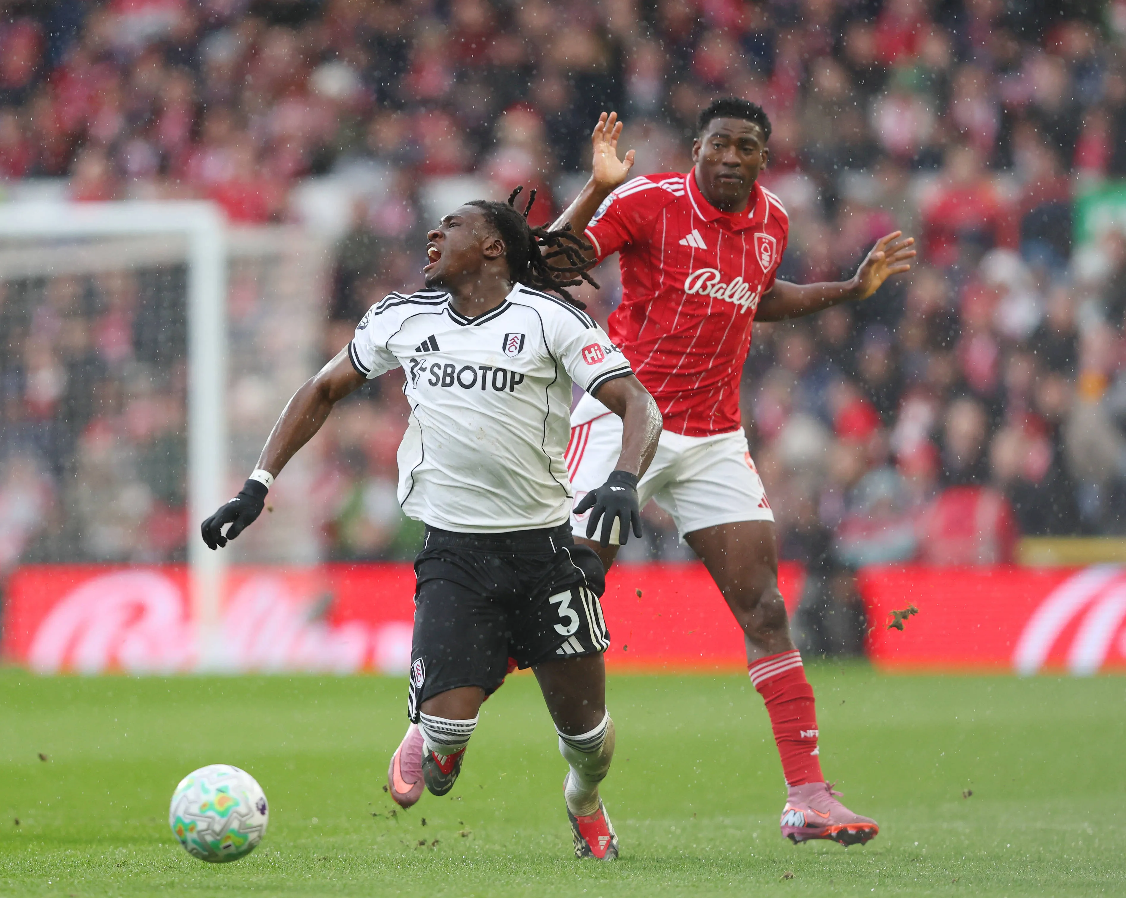 Calvin Bassey and Taiwo Awoniyi during the Nottingham Forest vs Fulham Premier League match at the City Ground, Nottingham