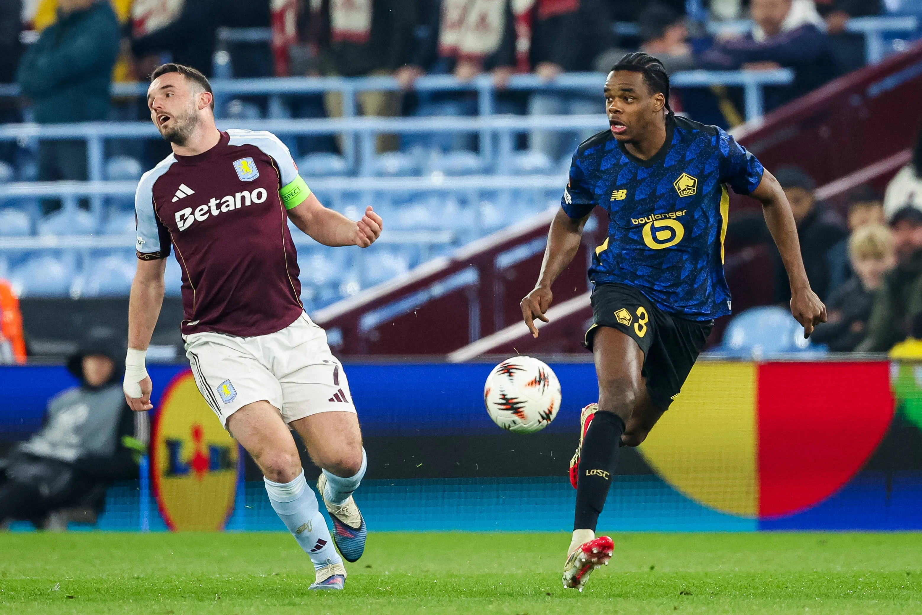 John McGinn of Aston Villa and Nathan Ngoy of Lille OSC