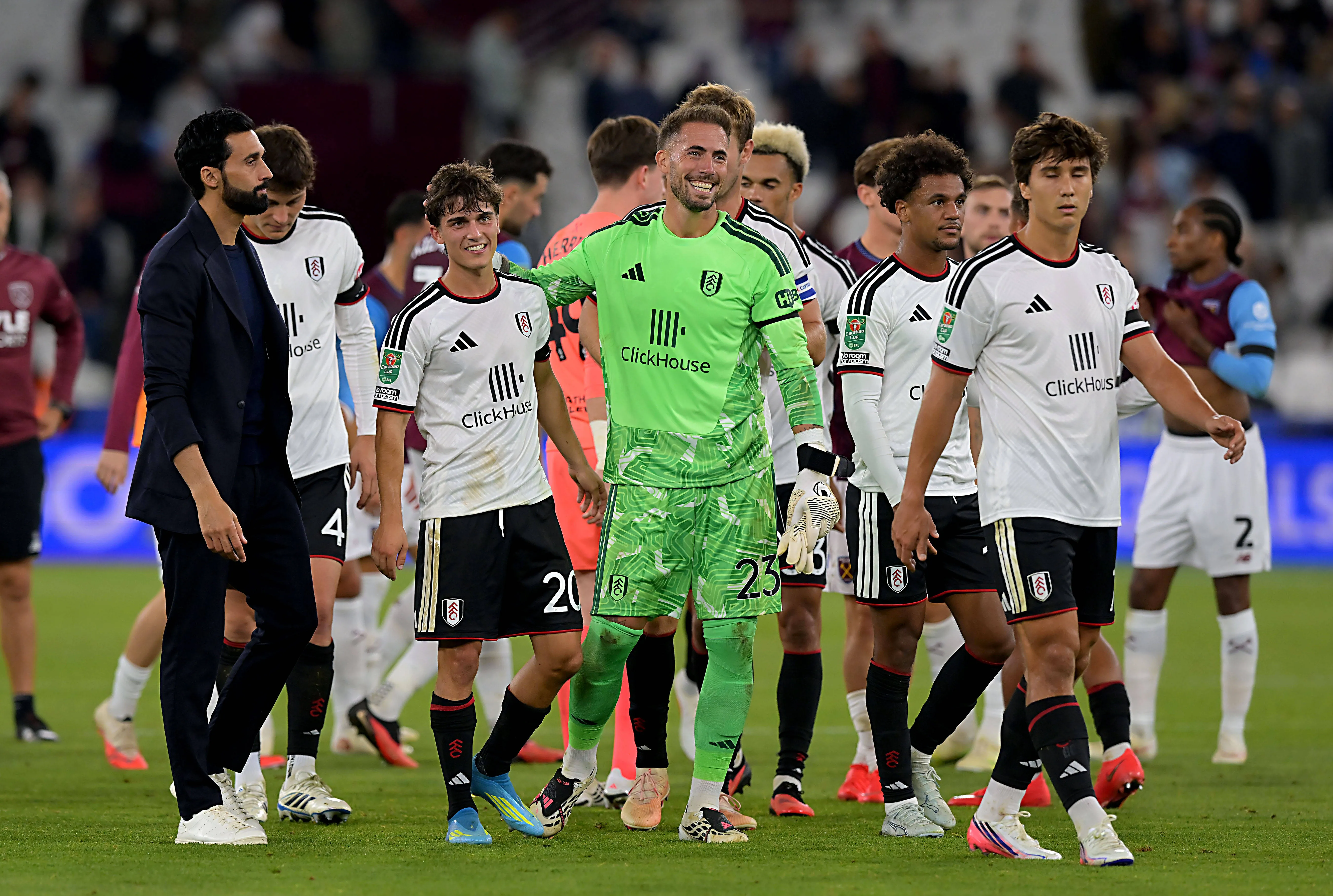 Fulham players celebrate along with coach Alvaro Arbeloa. 