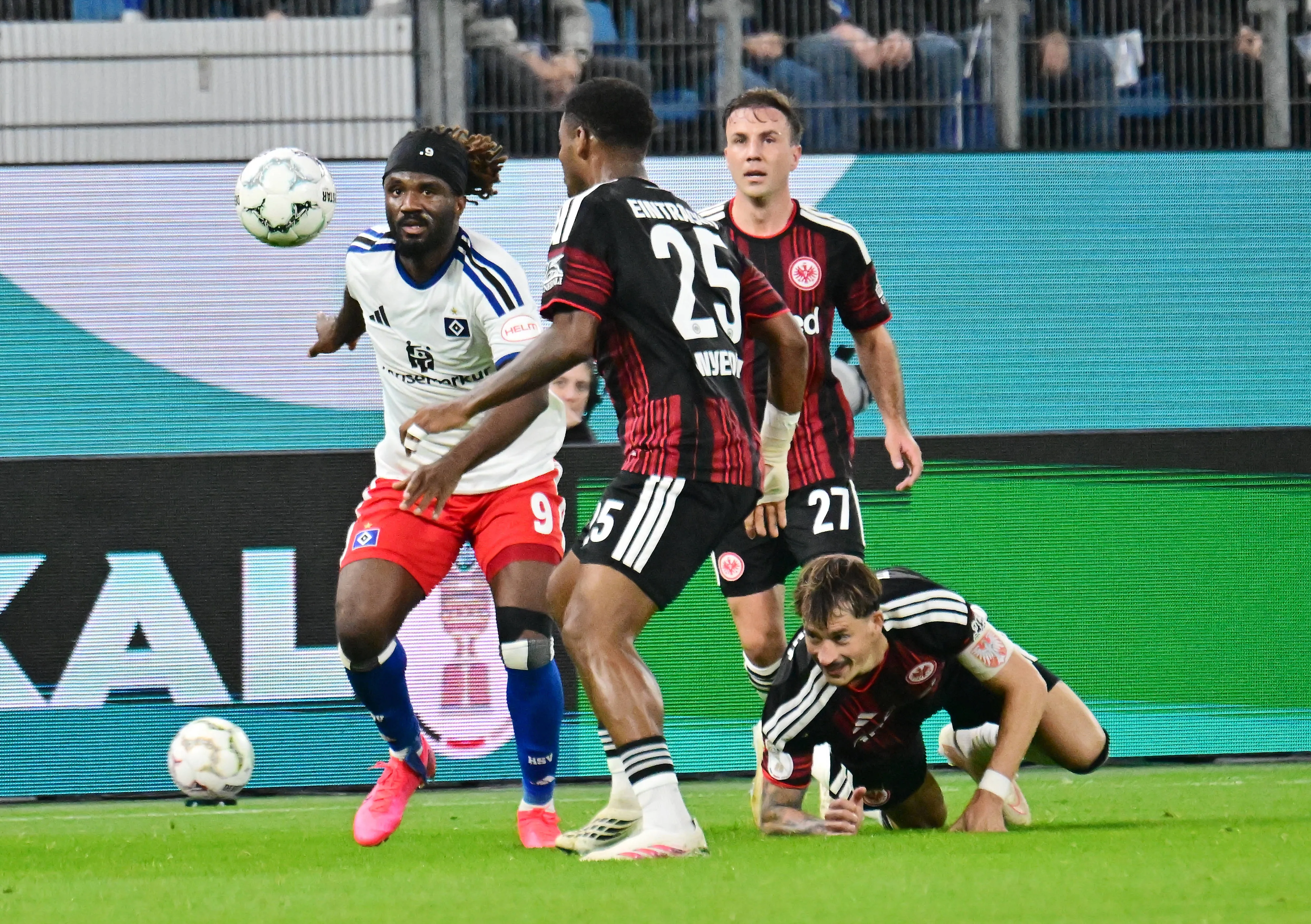 Terem Moffi and Raphael Onyedika do battle during Frankfurt vs Hamburger 