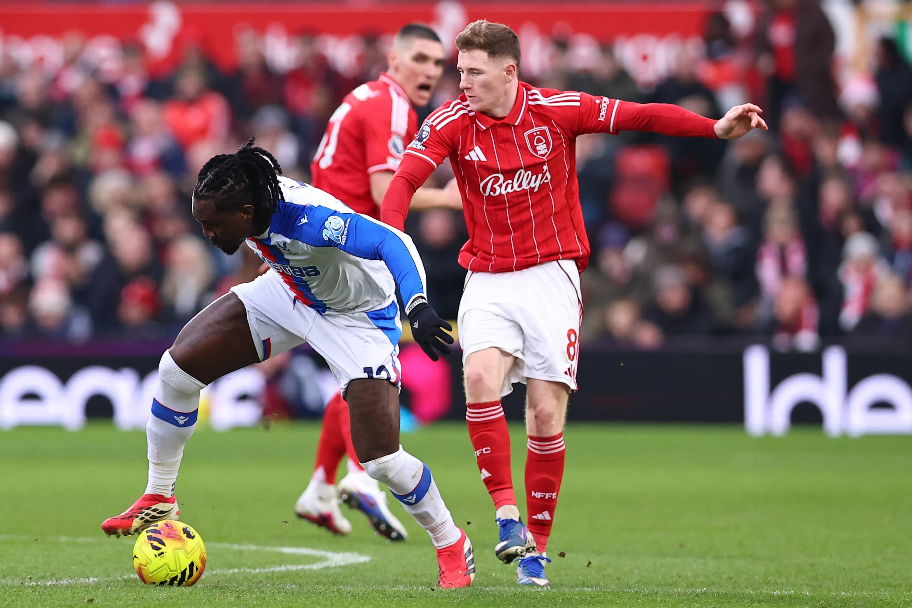 Christantus Uche and Elliot Anderson battle for possession during the Nottingham Forest v Crystal Palace Premier League match at the City Ground