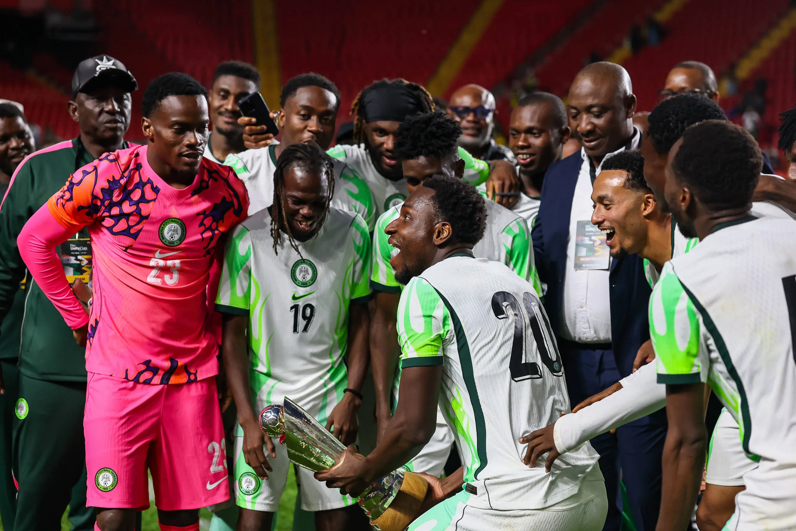 Nigeria forward Philip Otele 20 lifts the Unity Cup Trophy