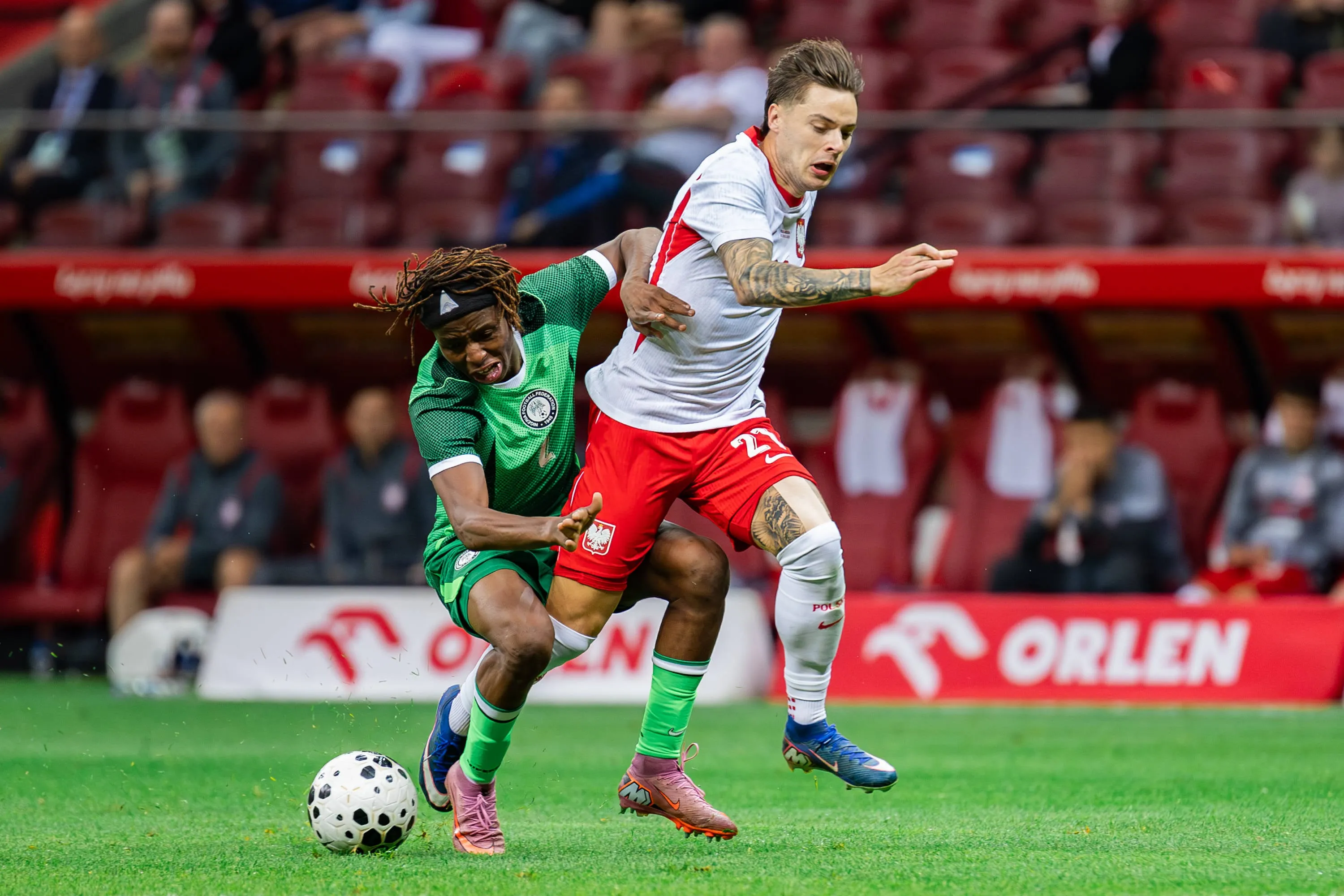 Abdullahi Bewene of Nigeria and Nicola Zalewski of Poland in action
