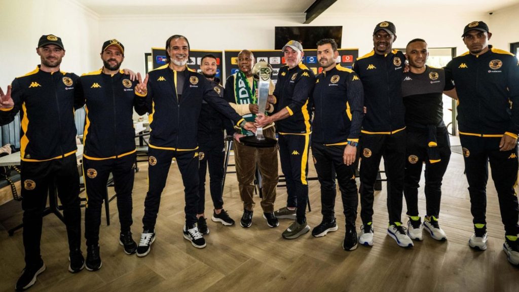 Kaizer Motaung received Nedbank Cup from technical team. Photo – Kaizer Chiefs