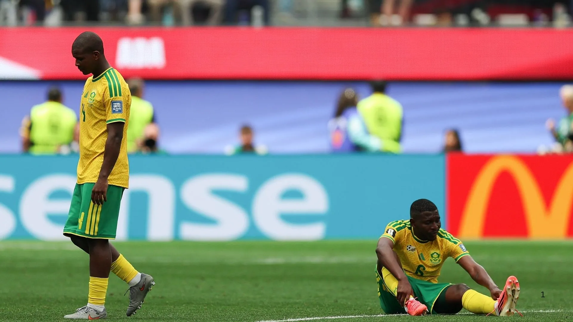 Mbakezeli Mbokazi and Aubrey Modiba of South Africa after World Cup defeat to Canada.