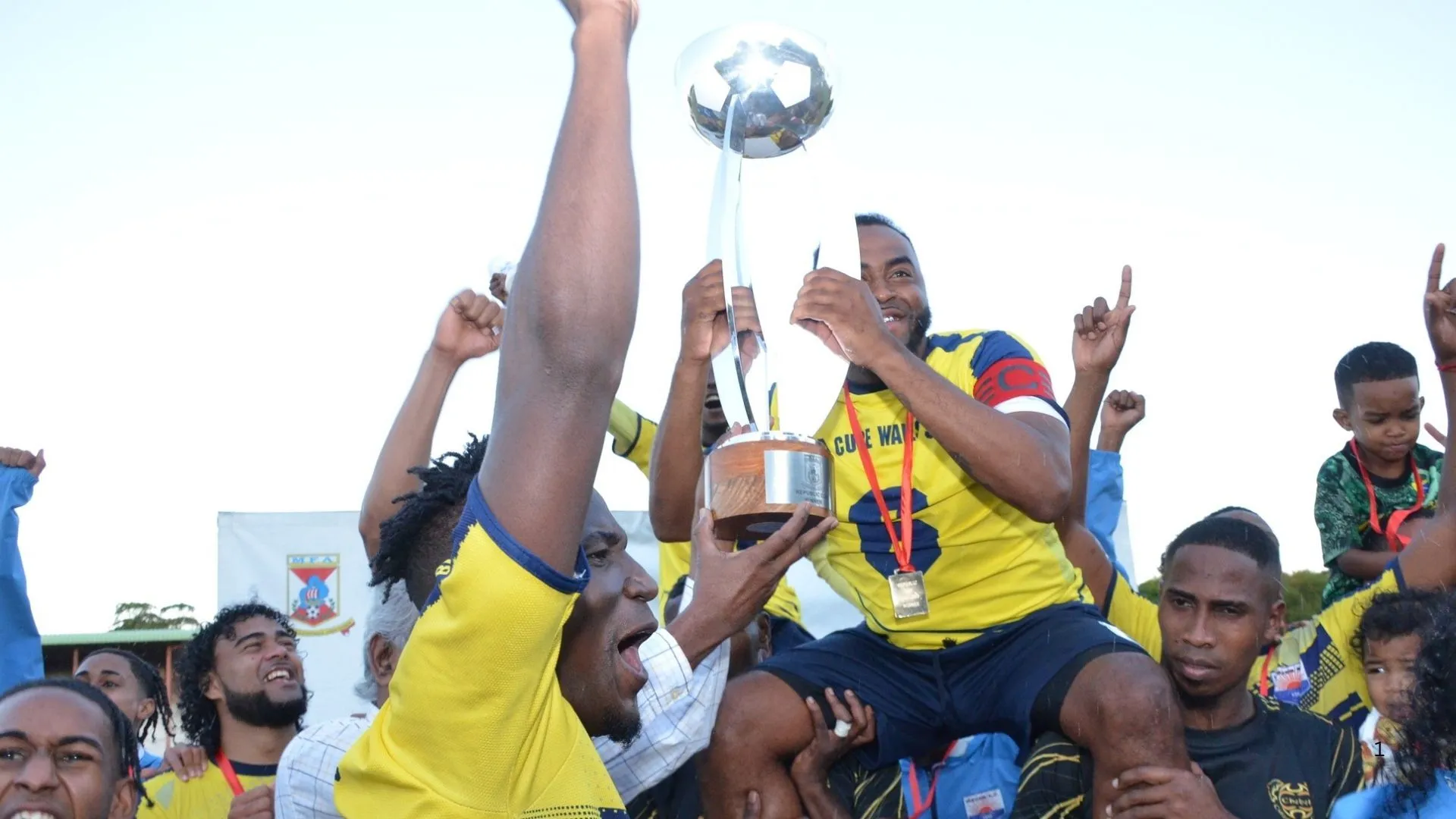 La Cure Waves squad celebrate title glory.