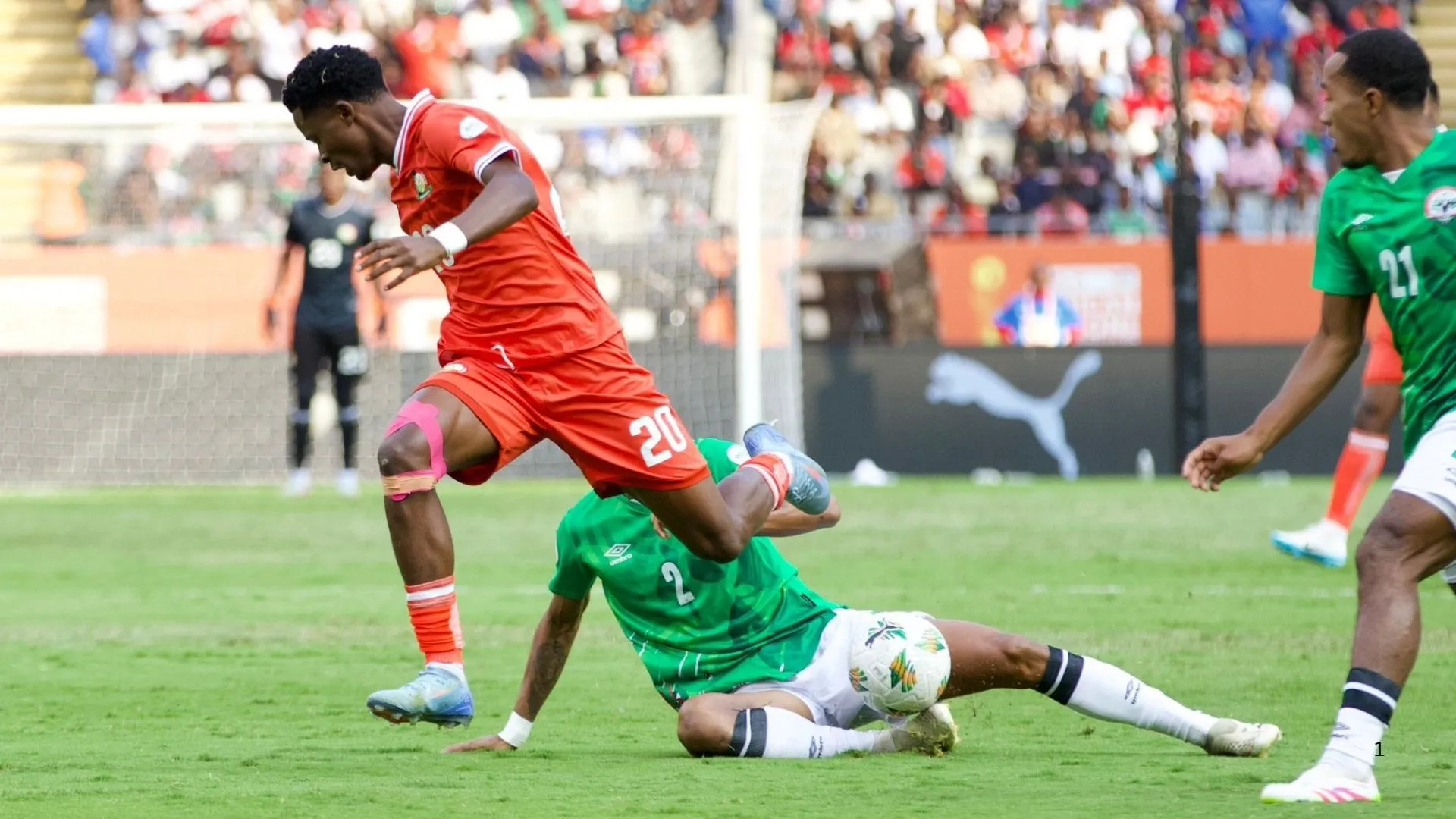 Manzur Okwaro of Kenya challenges for the ball against Madagascar.