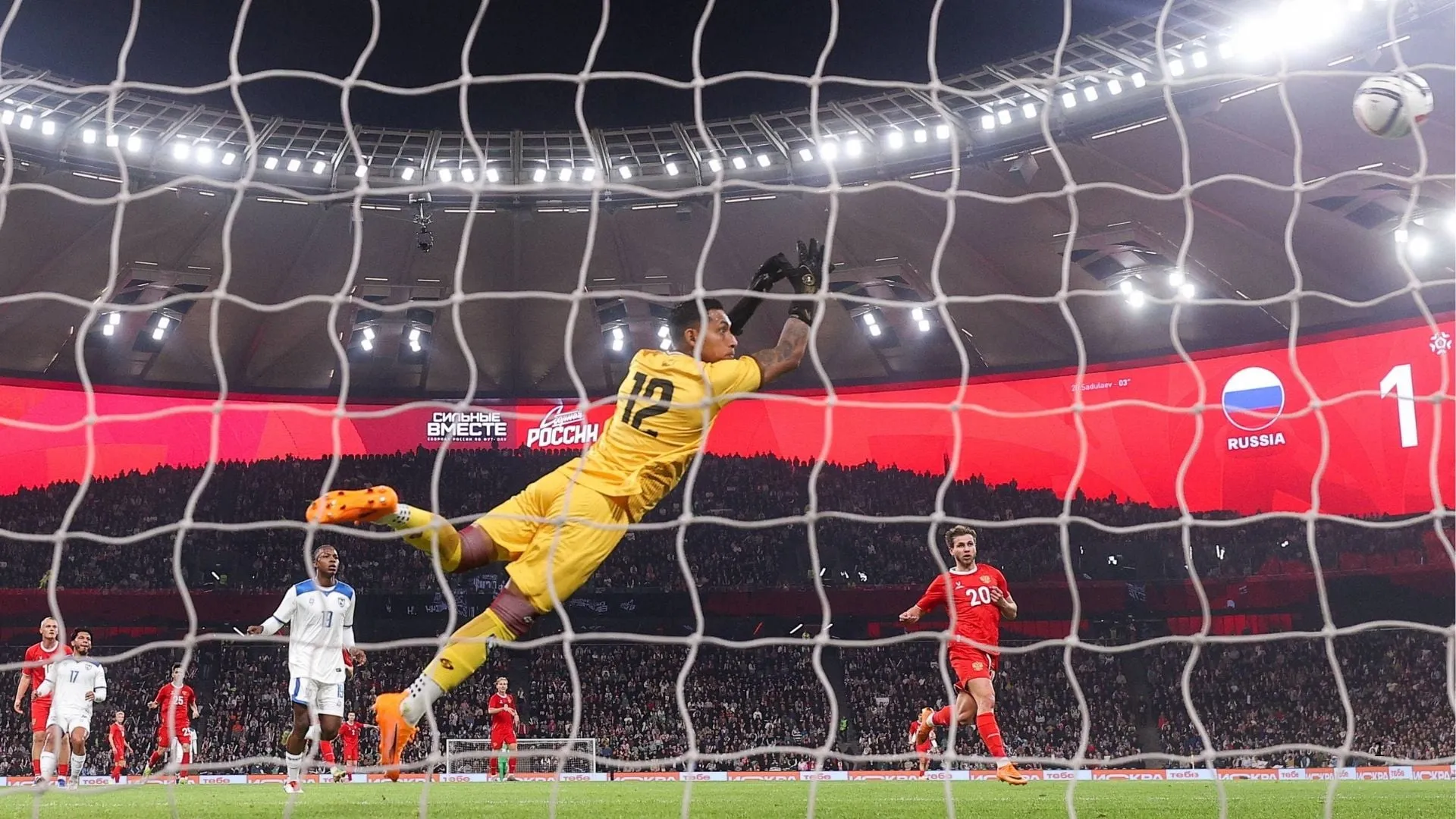 Nicaragua goalkeeper Adonis Pineda dives during a friendly match against Russia.