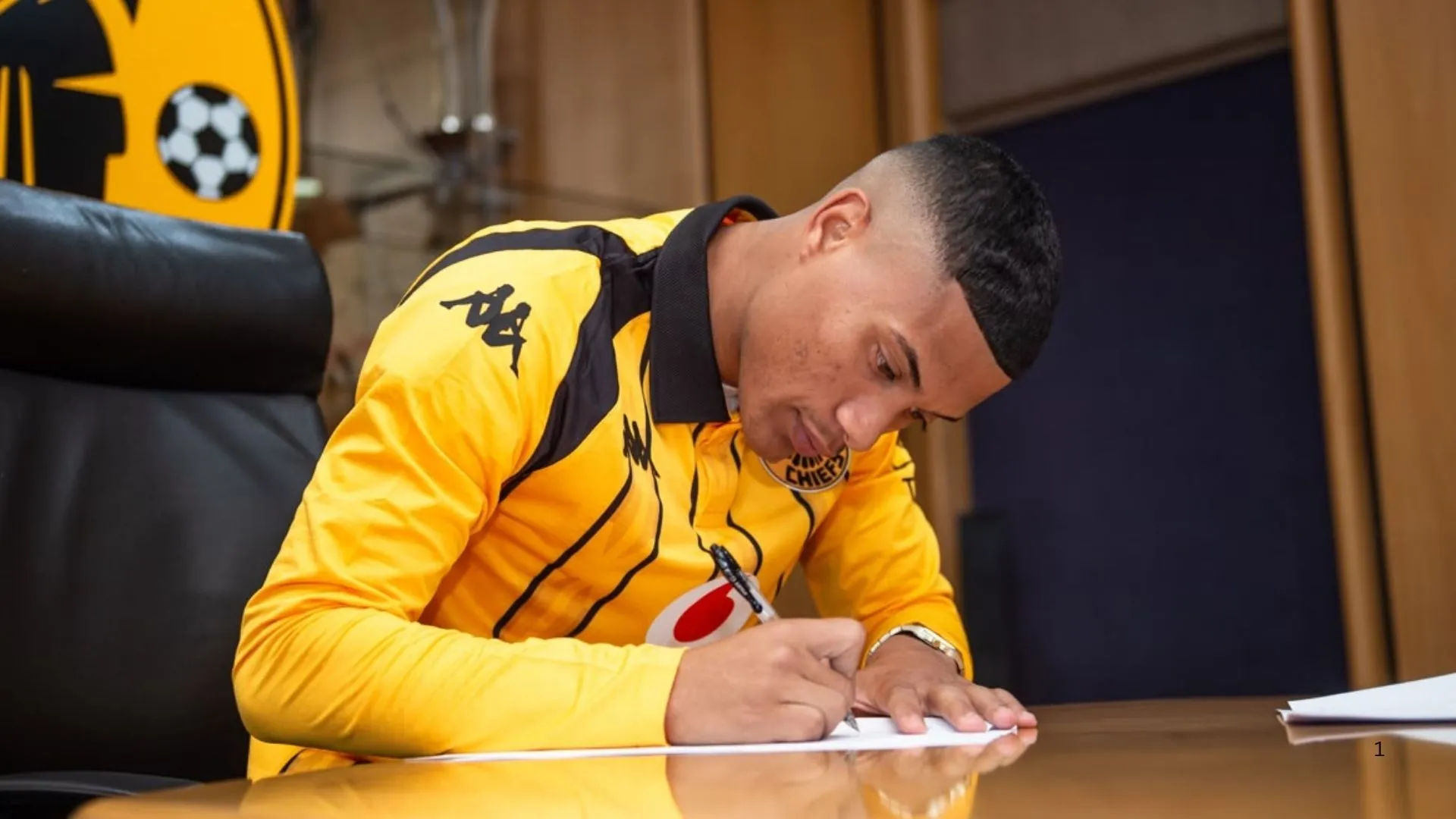 Faiz Abrahams signs his contract at Kaizer Chiefs.