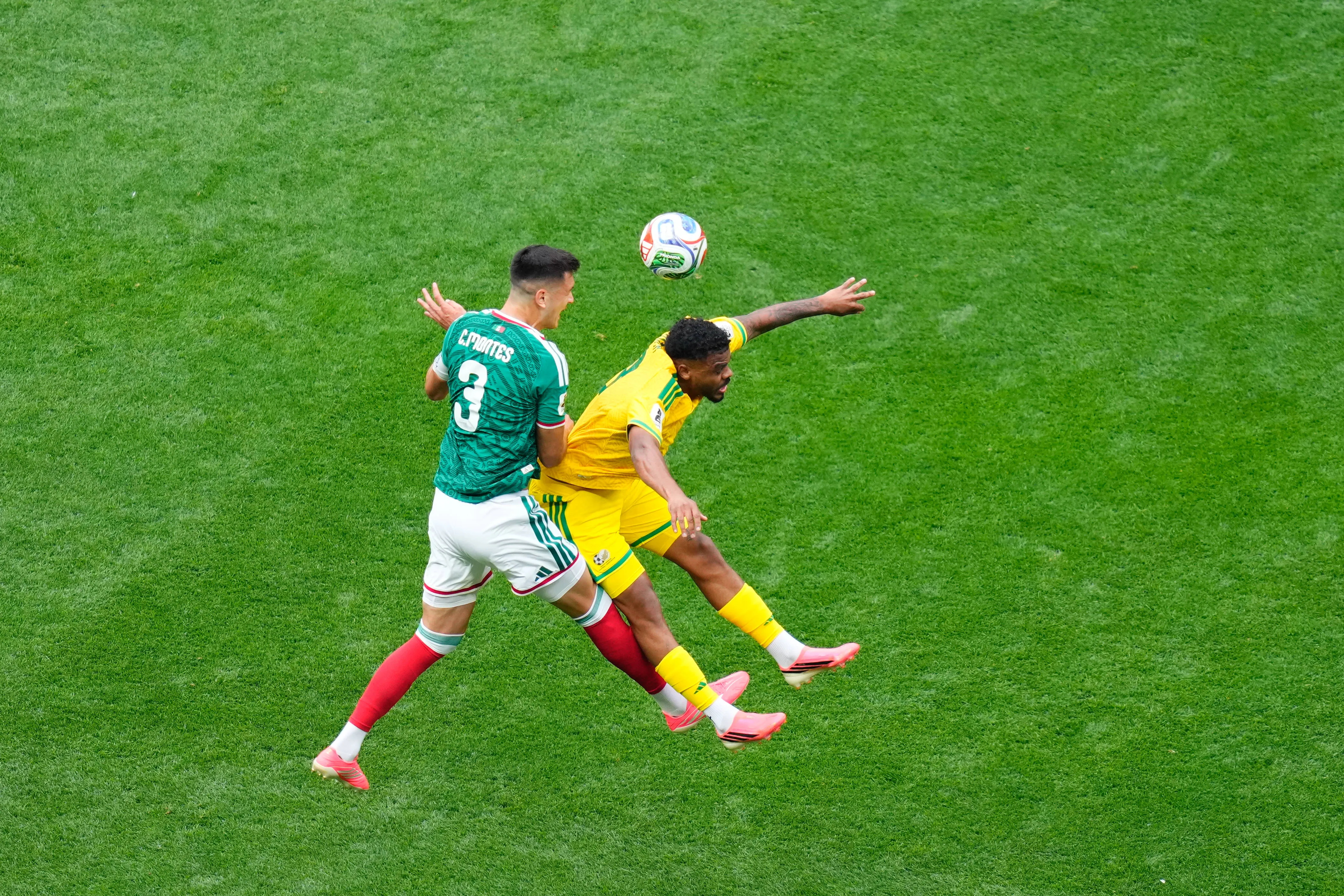 Lyle Foster of South Africa and Cesar Montes of Mexico