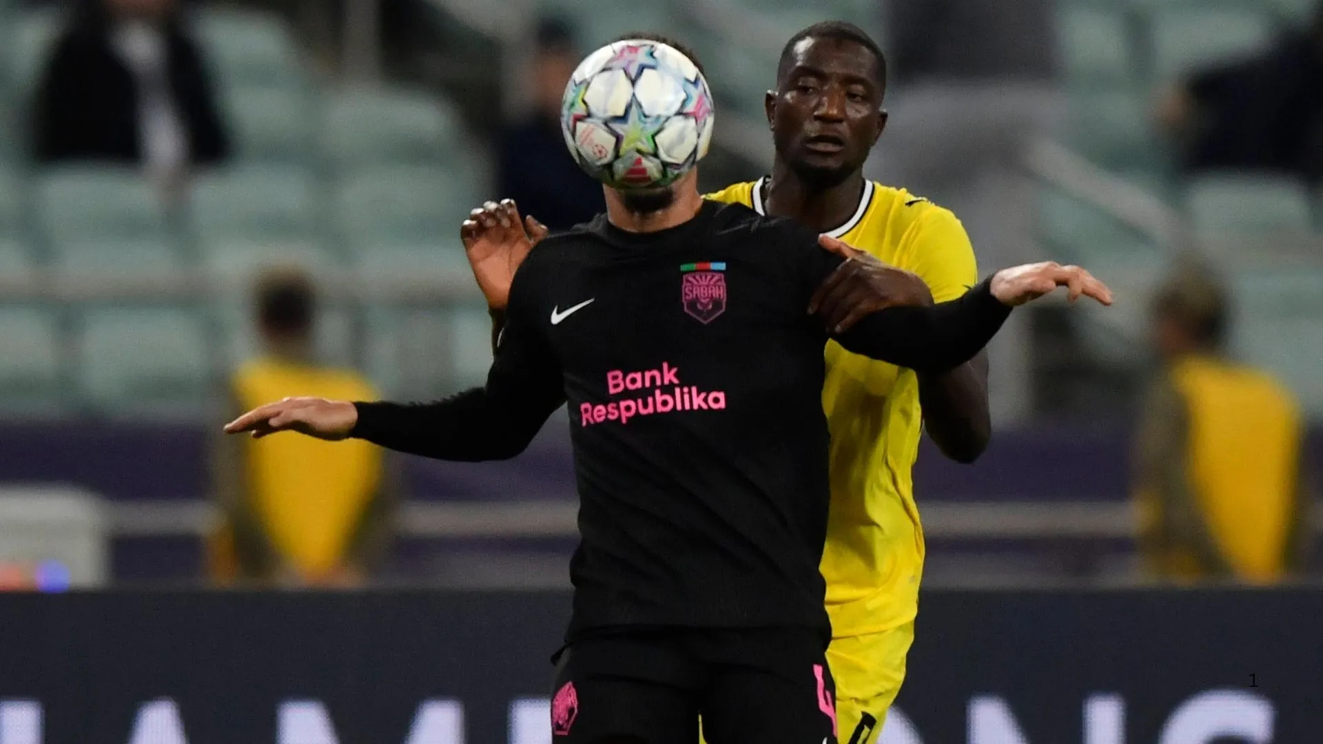 Aden McCarthy facing off with Serhou Guirassy of Borussia Dortmund in the Champions League.