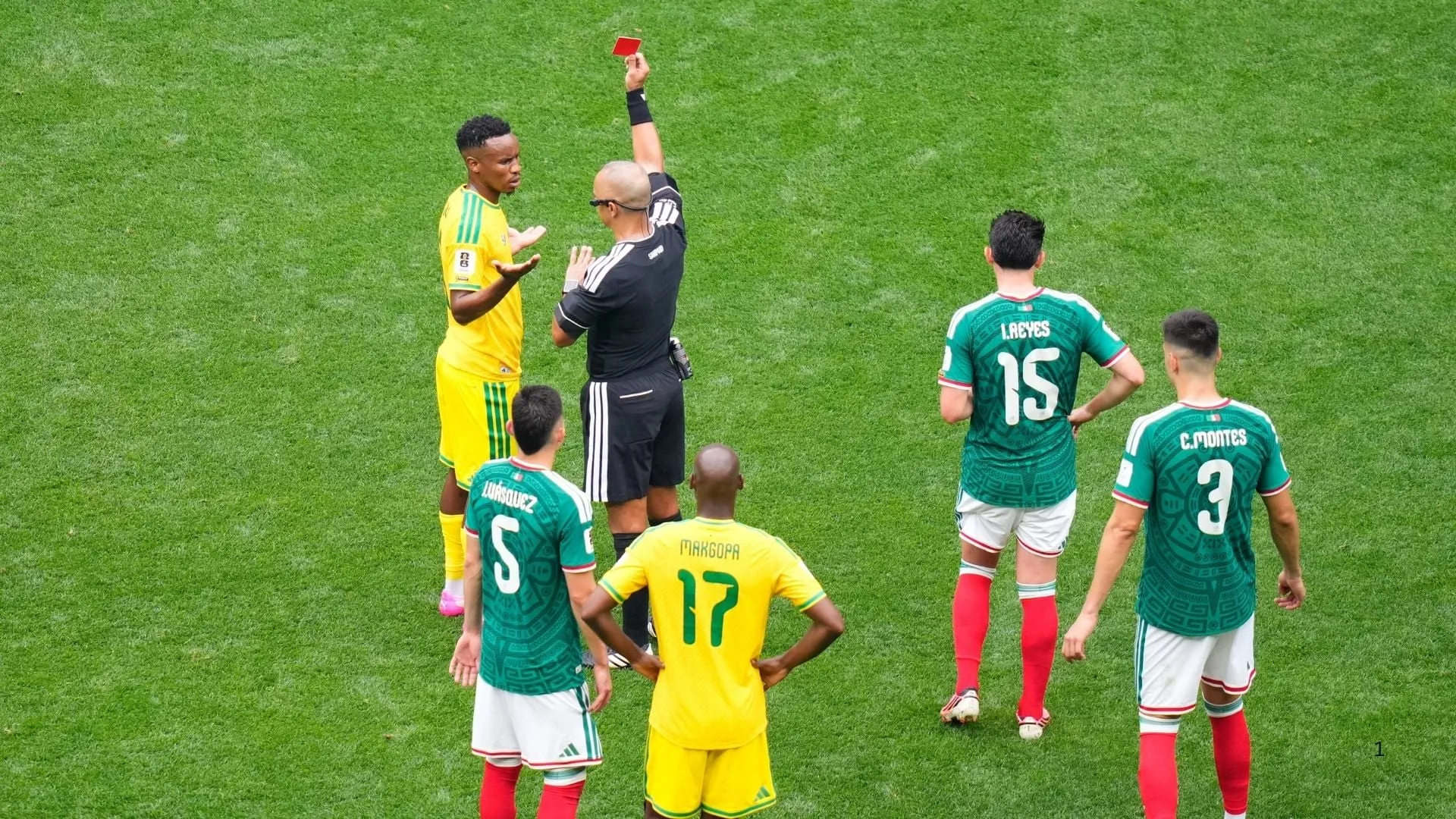 Themba Zwane of South Africa receives a red card against Mexico.