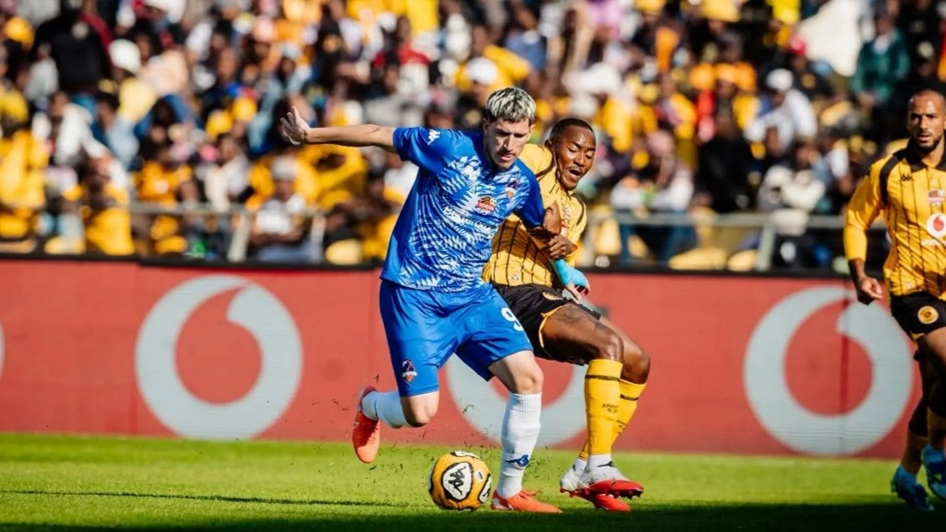 Lebohang Maboe of Kaizer Chiefs challenging for the ball against Scotlland FC.