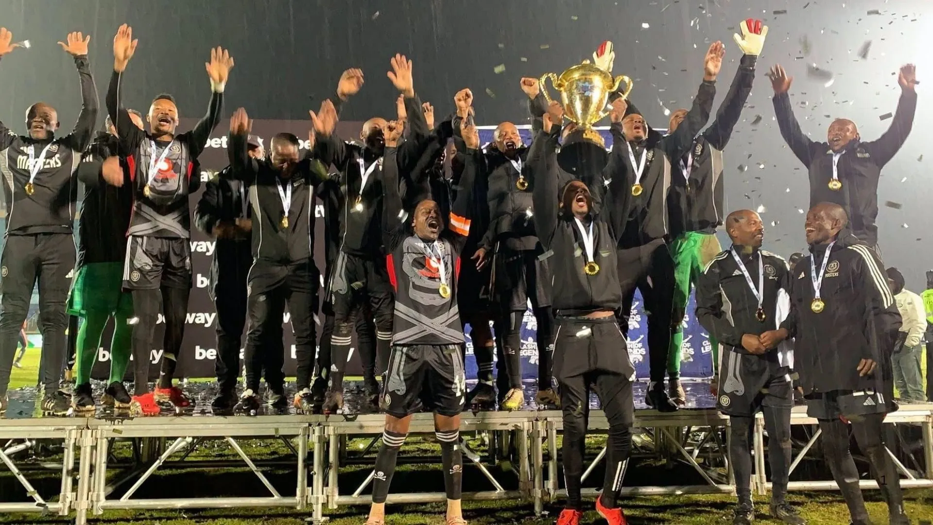 Orlando Pirates legends celebrate winning the Clash of Legends cup.