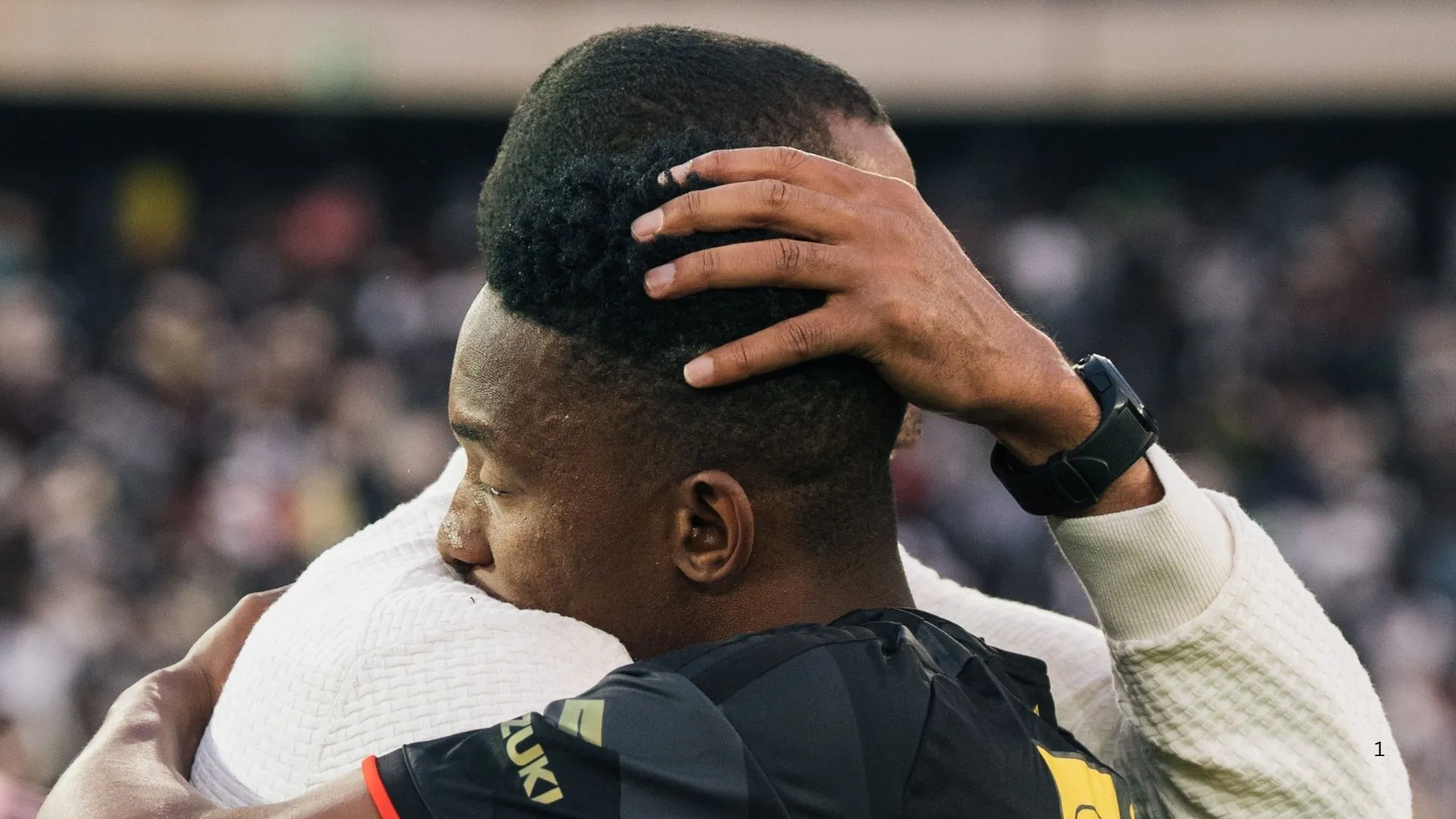 Orlando Pirates coach Abdeslam Ouaddou hugs Thalente Mbatha after his team's MTN8 win.