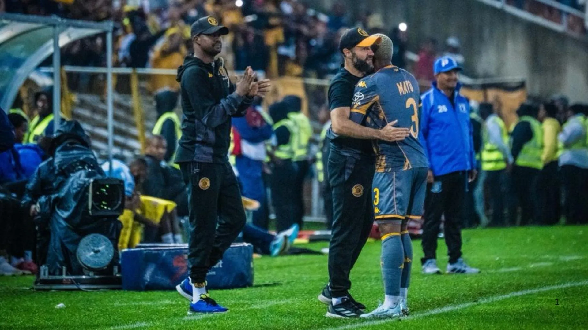 Khanyisa Mayo of Kaizer Chiefs hugs coach Khalil Ben Youssef