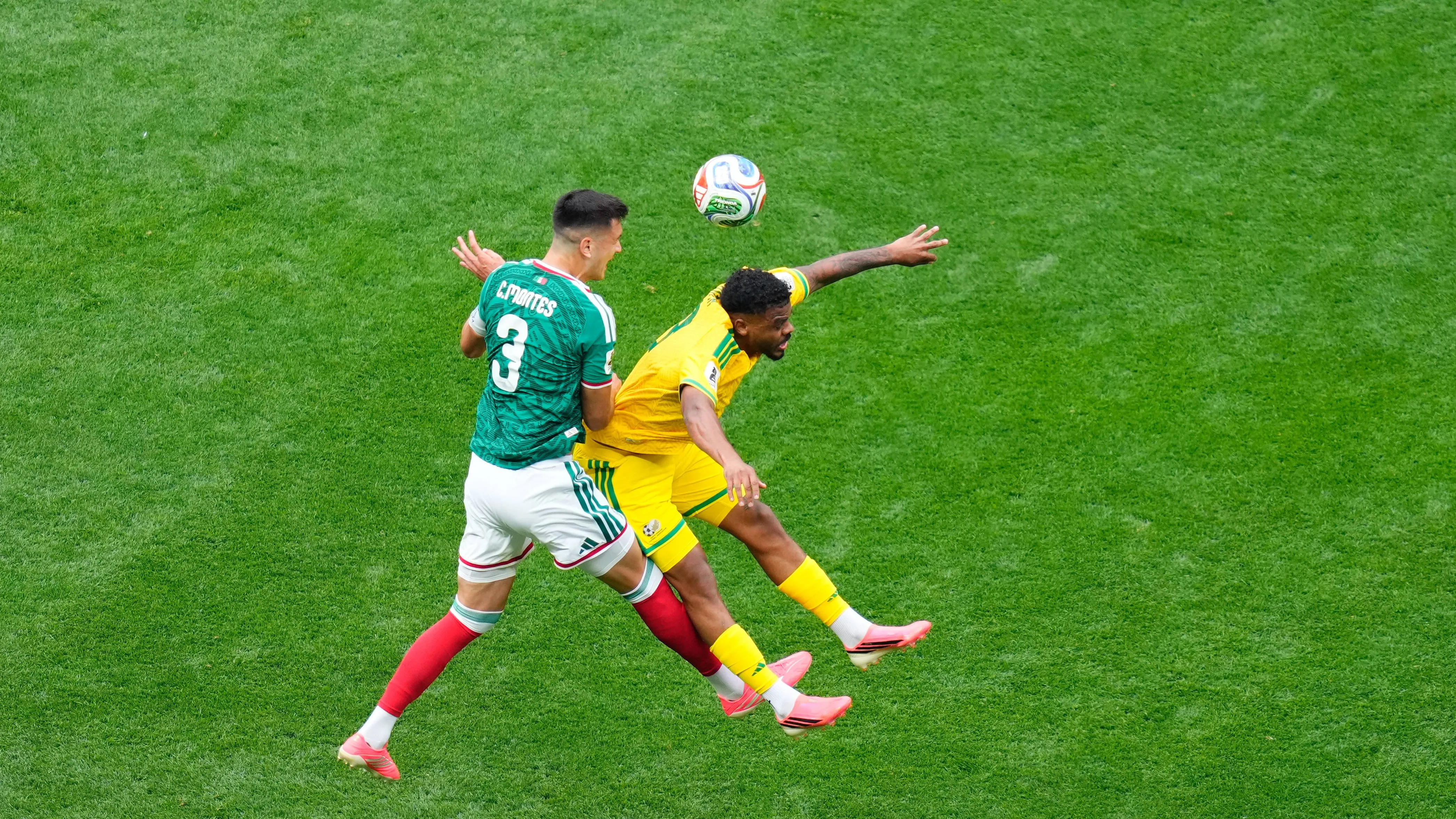 Lyle Foster of South Africa and Cesar Montes of Mexico