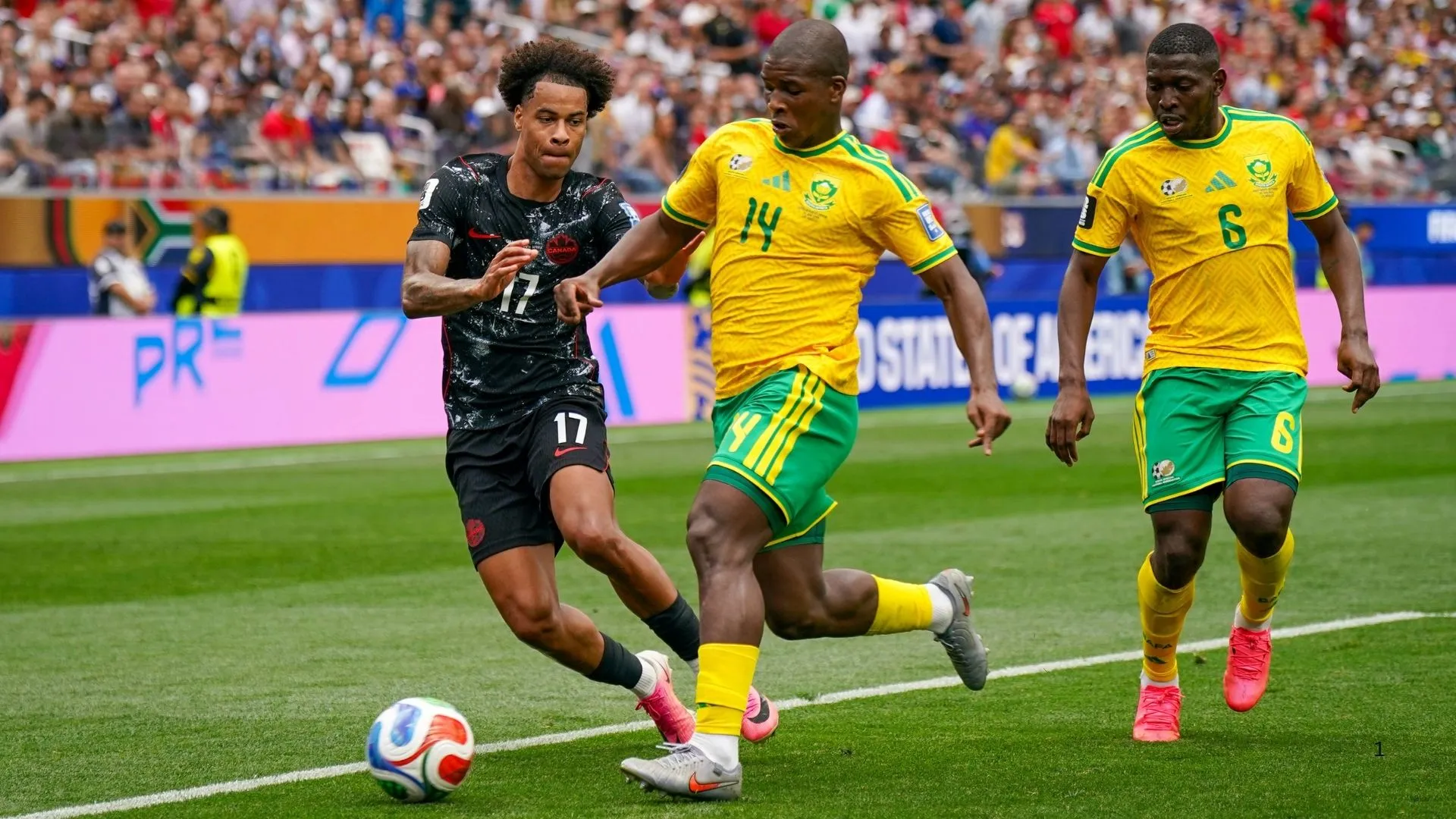 Mbekezeli Mbokazi vies shields the ball during Bafana's World Cup match against Canada.