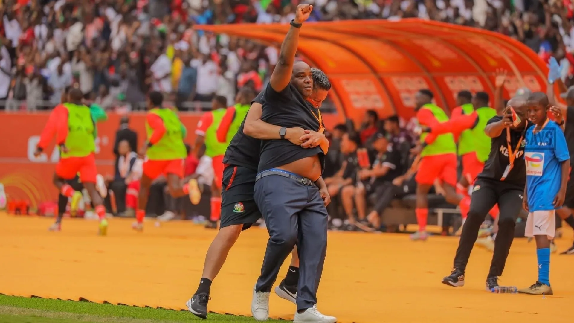 Benni McCarthy celebrates Kenya's goal against Morocco.