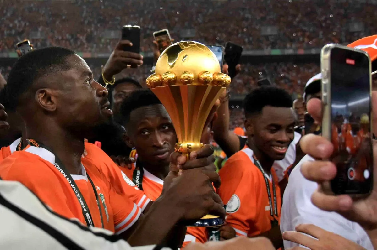 AFCON 2024 Final in Ivory Coast Ivory Coast players celebrate with the Africa Cup of Nations trophy after winning the fi
