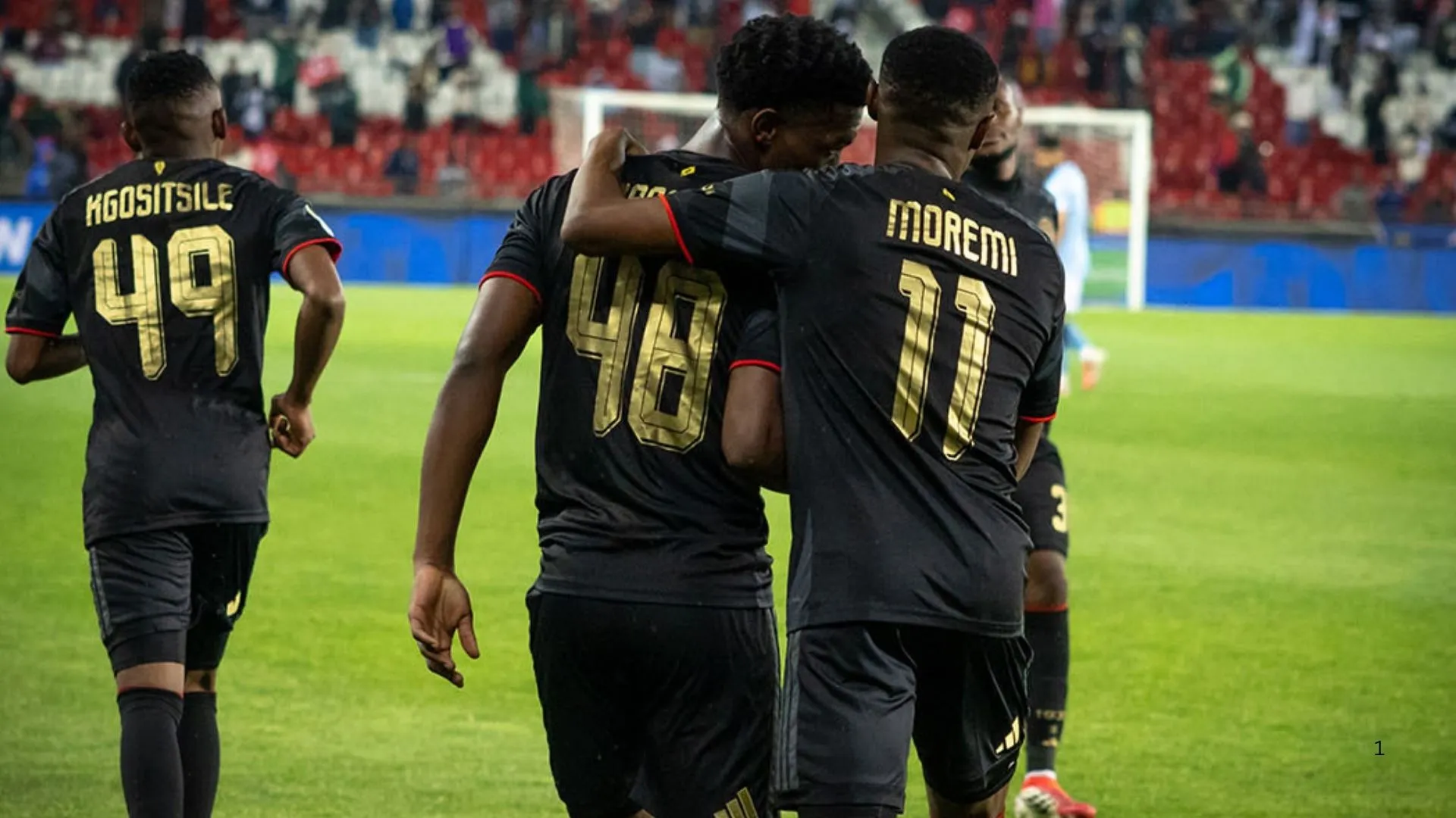 Kabelo Kgosietsile, Simphiwe Masilela and Tshepang Moremi of Orlando Pirates celebrate a goal.
