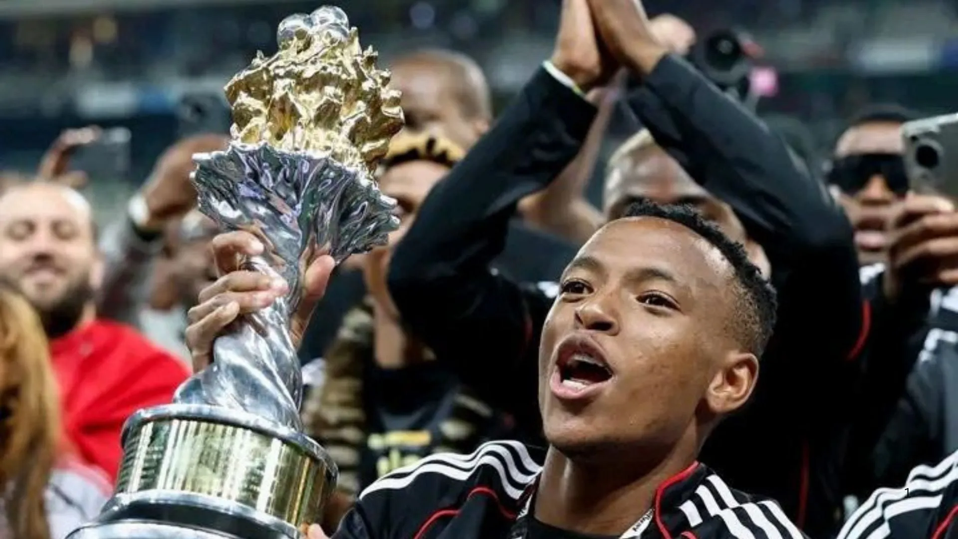 Relebohile Mofokeng celebrates PSL title wn with Orlando Pirates.