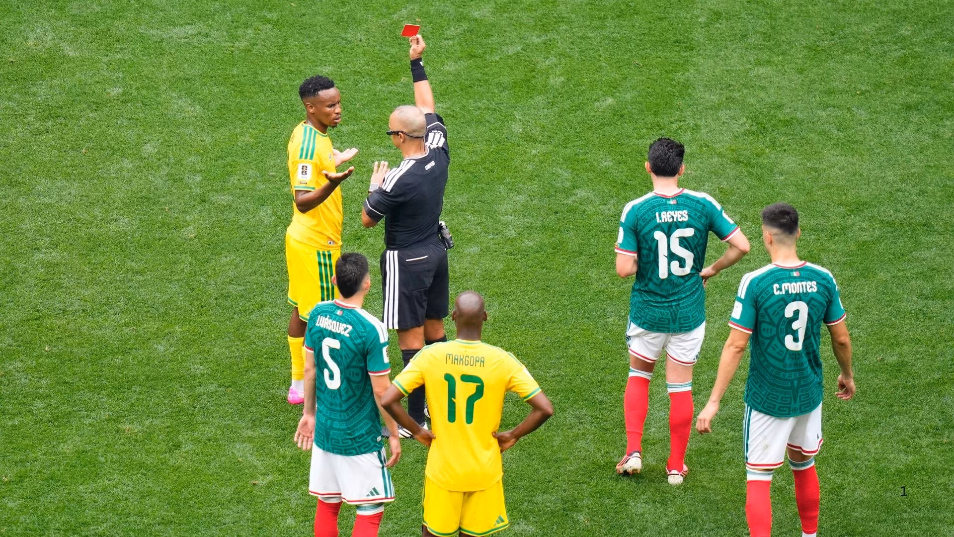 Themba Zwane of South Africa receives a red card against Mexico.